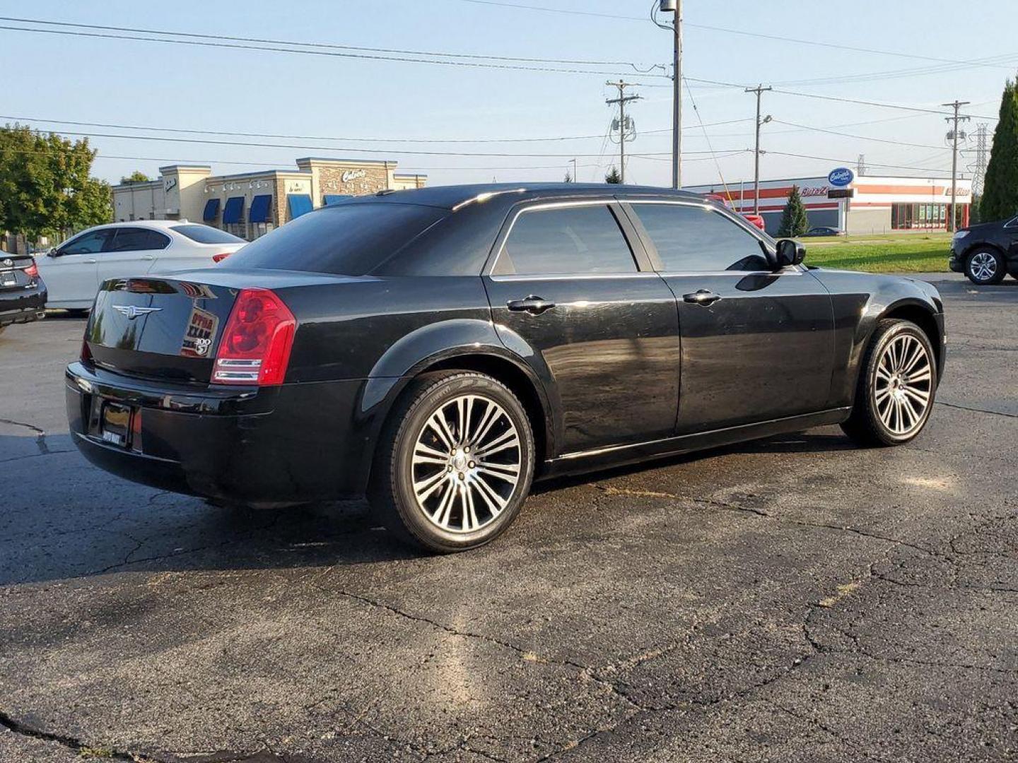 2010 Black Clearcoat /Dark Slate Gray Chrysler 300 S V6 (2C3CA2CVXAH) with an 3.5L V6 SOHC 24V engine, 4-Speed Automatic transmission, located at 6064 Gull Rd, Kalamazoo, MI, 49048, (269) 222-0088, 42.328388, -85.512924 - Discover exceptional value and luxury with our 2010 Chrysler 300 S, a premium sedan that combines style, performance, and comfort. Perfectly maintained and featuring a CARFAX Clean Report, this vehicle is ready to deliver a top-notch driving experience.<br><br>Under the hood, the 300 S boasts a robu - Photo#3