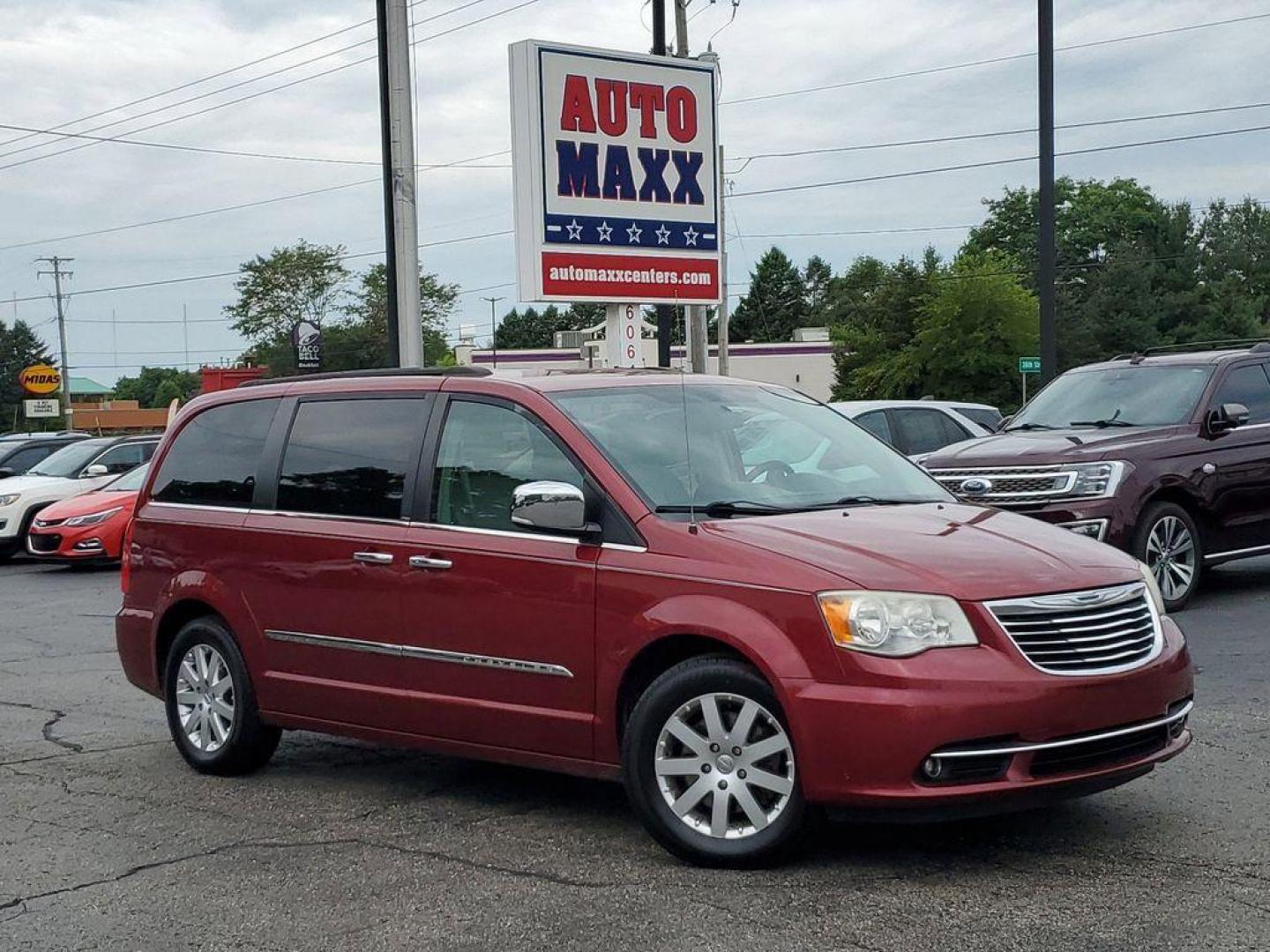 2012 Deep Cherry Red Crystal Pearlcoat /Black/Light Graystone Chrysler Town and Country Touring-L (2C4RC1CG5CR) with an 3.6L V6 DOHC 24V engine, 6-Speed Automatic transmission, located at 234 Columbia Ave, Battle Creek, MI, 49015, (269) 222-0088, 42.298264, -85.192543 - Discover exceptional value and comfort with our 2012 Chrysler Town and Country Touring-L, now available at our dealership. This versatile minivan, equipped with Front-Wheel Drive and a robust V6, 3.6L engine, promises a smooth and reliable driving experience for you and your family.<br><br>The Tou - Photo#0