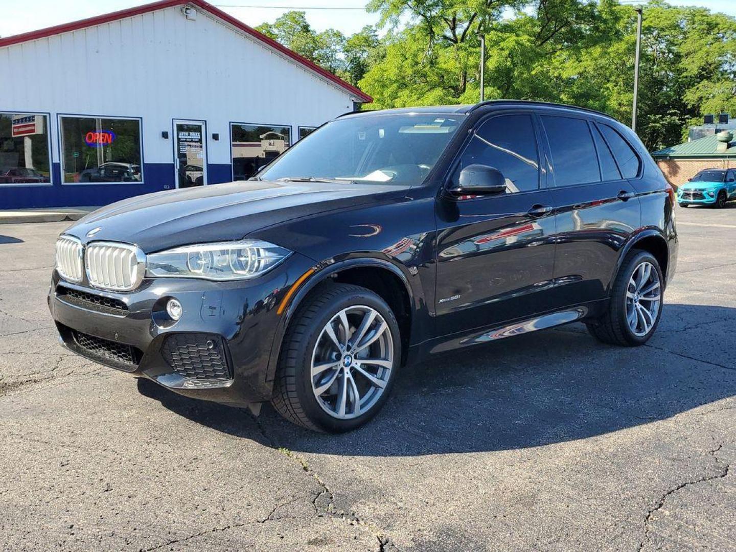 2015 Black Sapphire Metallic /Black BMW X5 xDrive50i (5UXKR6C5XF0) with an 4.8L V8 DOHC 32V engine, 8-Speed Automatic transmission, located at 6064 Gull Rd, Kalamazoo, MI, 49048, (269) 222-0088, 42.328388, -85.512924 - <b>Vehicle Details</b><br>Experience the perfect blend of luxury and performance with our 2015 BMW X5 xDrive50i. This sophisticated SUV is equipped with a powerful V8, 4.4L engine and intelligent all-wheel drive system, ensuring a dynamic driving experience in any condition. The exterior boasts a sl - Photo#0