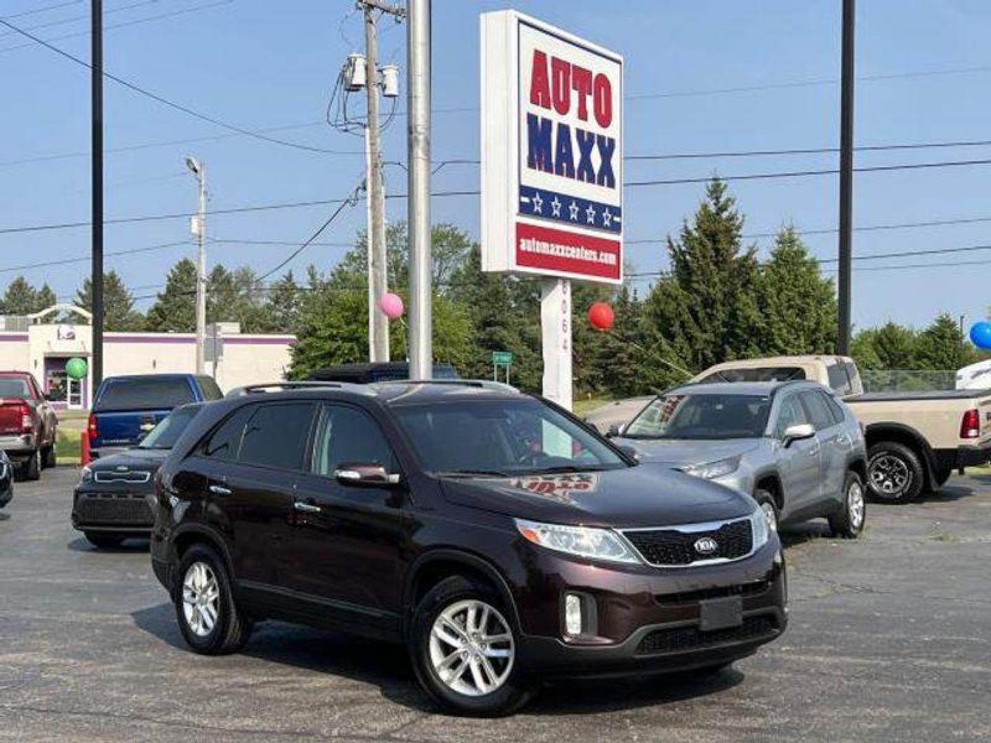 2015 Dark Cherry /Black Kia Sorento LX V6 FWD (5XYKT4A73FG) with an 3.3L V6 DOHC 24V engine, 6-Speed Automatic transmission, located at 6064 Gull Rd, Kalamazoo, MI, 49048, (269) 222-0088, 42.328388, -85.512924 - <b>Vehicle Details</b><br>Introducing the exceptional 2015 Kia Sorento LX, a remarkable SUV that combines versatility, reliability, and style. With only one previous owner and a clean CARFAX report, this vehicle is the epitome of dependability. Boasting a stunning exterior finished in a sleek and ti - Photo#0