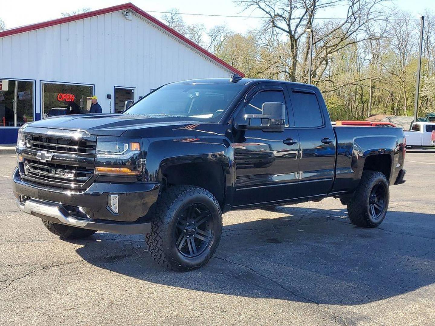 2016 Black /Jet Black Chevrolet Silverado 1500 LT Double Cab 4WD (1GCVKREC7GZ) with an 5.3L V8 OHV 16V engine, 6A transmission, located at 6064 Gull Rd, Kalamazoo, MI, 49048, (269) 222-0088, 42.328388, -85.512924 - <b>Vehicle Details</b><br>Looking for a reliable and powerful truck that can handle any terrain? Look no further than this 2016 Chevrolet Silverado 1500 LT with 4WD and a V8, 5.3L engine. With 142936 miles on the odometer, this truck is ready to take on any challenge you throw its way. Equipped wit - Photo#0