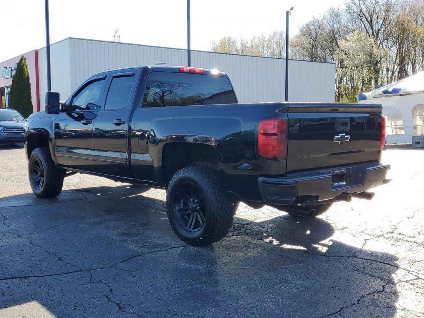 2016 Black /Jet Black Chevrolet Silverado 1500 LT Double Cab 4WD (1GCVKREC7GZ) with an 5.3L V8 OHV 16V engine, 6A transmission, located at 6064 Gull Rd, Kalamazoo, MI, 49048, (269) 222-0088, 42.328388, -85.512924 - <b>Vehicle Details</b><br>Looking for a reliable and powerful truck that can handle any terrain? Look no further than this 2016 Chevrolet Silverado 1500 LT with 4WD and a V8, 5.3L engine. With 142936 miles on the odometer, this truck is ready to take on any challenge you throw its way. Equipped wit - Photo#1