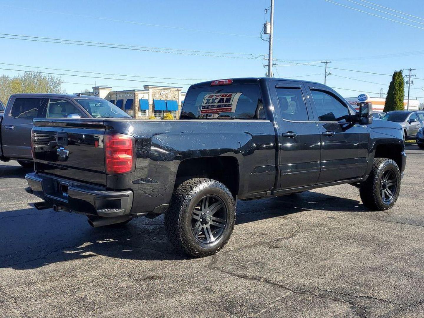 2016 Black /Jet Black Chevrolet Silverado 1500 LT Double Cab 4WD (1GCVKREC7GZ) with an 5.3L V8 OHV 16V engine, 6A transmission, located at 6064 Gull Rd, Kalamazoo, MI, 49048, (269) 222-0088, 42.328388, -85.512924 - <b>Vehicle Details</b><br>Looking for a reliable and powerful truck that can handle any terrain? Look no further than this 2016 Chevrolet Silverado 1500 LT with 4WD and a V8, 5.3L engine. With 142936 miles on the odometer, this truck is ready to take on any challenge you throw its way. Equipped wit - Photo#2