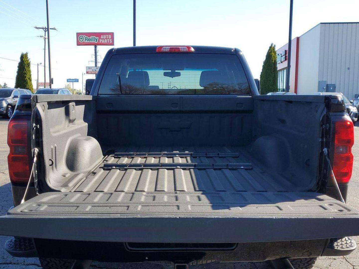 2016 Black /Jet Black Chevrolet Silverado 1500 LT Double Cab 4WD (1GCVKREC7GZ) with an 5.3L V8 OHV 16V engine, 6A transmission, located at 6064 Gull Rd, Kalamazoo, MI, 49048, (269) 222-0088, 42.328388, -85.512924 - <b>Vehicle Details</b><br>Looking for a reliable and powerful truck that can handle any terrain? Look no further than this 2016 Chevrolet Silverado 1500 LT with 4WD and a V8, 5.3L engine. With 142936 miles on the odometer, this truck is ready to take on any challenge you throw its way. Equipped wit - Photo#4