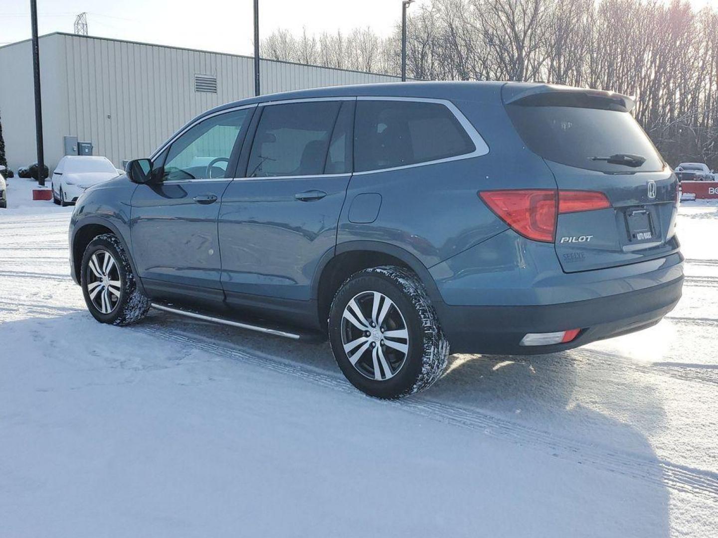 2016 Steel Sapphire Metallic /Beige Honda Pilot EXL 4WD (5FNYF6H56GB) with an 3.5L V6 SOHC 24V engine, 6-Speed Automatic transmission, located at 6064 Gull Rd, Kalamazoo, MI, 49048, (269) 222-0088, 42.328388, -85.512924 - Introducing the impeccable 2016 Honda Pilot EX-L, a remarkable SUV that stands out with its perfect blend of style, performance, and luxury. This vehicle is a pristine gem with 0 miles, ready to embark on countless adventures with its new owner. Under the hood, you'll find a robust V6, 3.5L engine t - Photo#2