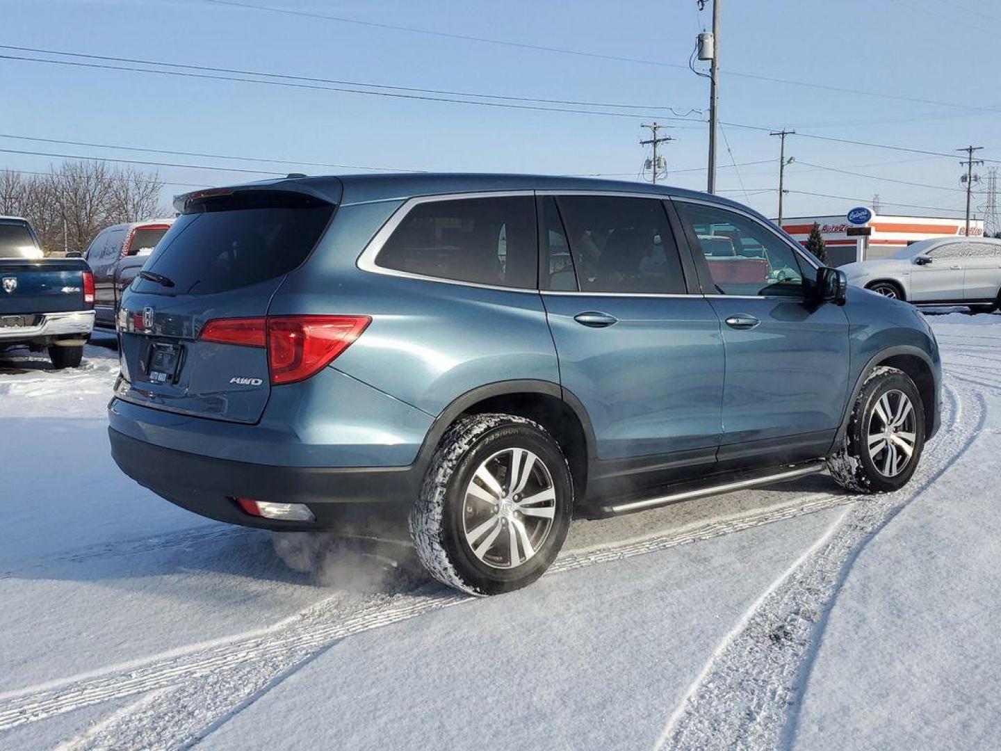 2016 Steel Sapphire Metallic /Beige Honda Pilot EXL 4WD (5FNYF6H56GB) with an 3.5L V6 SOHC 24V engine, 6-Speed Automatic transmission, located at 6064 Gull Rd, Kalamazoo, MI, 49048, (269) 222-0088, 42.328388, -85.512924 - Introducing the impeccable 2016 Honda Pilot EX-L, a remarkable SUV that stands out with its perfect blend of style, performance, and luxury. This vehicle is a pristine gem with 0 miles, ready to embark on countless adventures with its new owner. Under the hood, you'll find a robust V6, 3.5L engine t - Photo#3