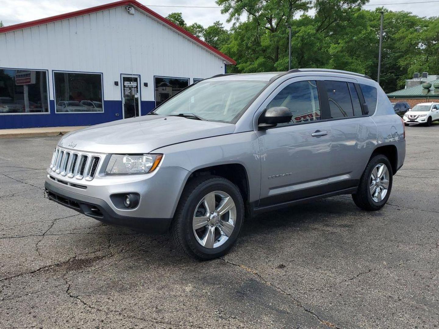 2016 Billet Silver Metallic Clearcoat /Dark Slate Gray Jeep Compass Sport 4WD (1C4NJDBBXGD) with an 2.4L L4 DOHC 16V engine, 6-speed automatic transmission, located at 6064 Gull Rd, Kalamazoo, MI, 49048, (269) 222-0088, 42.328388, -85.512924 - <b>Vehicle Details</b><br>Discover the thrill of adventure with our stunning 2016 Jeep Compass Sport! This bold and dynamic SUV is ready to tackle any terrain, thanks to its robust 4WD system and powerful L4, 2.4L engine. Whether you're navigating city streets or exploring off-road trails, the Compa - Photo#1