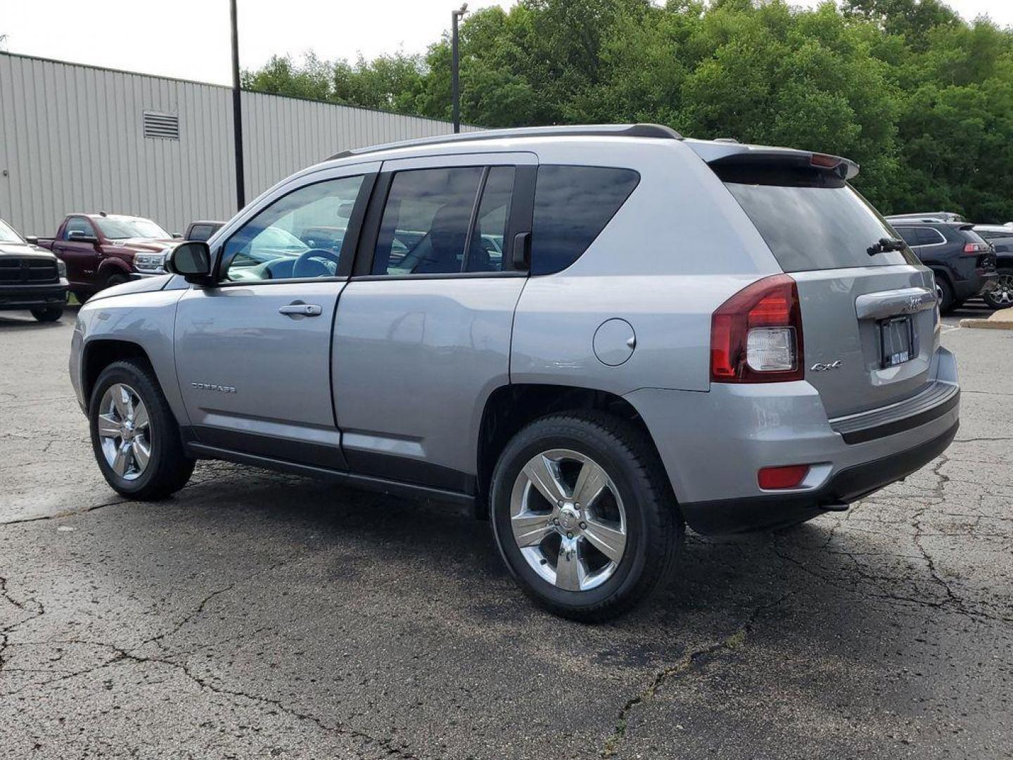 2016 Billet Silver Metallic Clearcoat /Dark Slate Gray Jeep Compass Sport 4WD (1C4NJDBBXGD) with an 2.4L L4 DOHC 16V engine, 6-speed automatic transmission, located at 6064 Gull Rd, Kalamazoo, MI, 49048, (269) 222-0088, 42.328388, -85.512924 - <b>Vehicle Details</b><br>Discover the thrill of adventure with our stunning 2016 Jeep Compass Sport! This bold and dynamic SUV is ready to tackle any terrain, thanks to its robust 4WD system and powerful L4, 2.4L engine. Whether you're navigating city streets or exploring off-road trails, the Compa - Photo#2