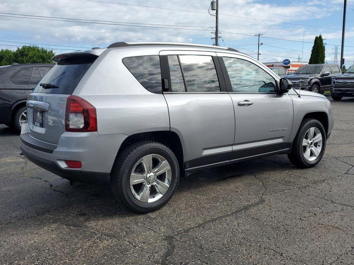 2016 Billet Silver Metallic Clearcoat /Dark Slate Gray Jeep Compass Sport 4WD (1C4NJDBBXGD) with an 2.4L L4 DOHC 16V engine, 6-speed automatic transmission, located at 6064 Gull Rd, Kalamazoo, MI, 49048, (269) 222-0088, 42.328388, -85.512924 - <b>Vehicle Details</b><br>Discover the thrill of adventure with our stunning 2016 Jeep Compass Sport! This bold and dynamic SUV is ready to tackle any terrain, thanks to its robust 4WD system and powerful L4, 2.4L engine. Whether you're navigating city streets or exploring off-road trails, the Compa - Photo#3