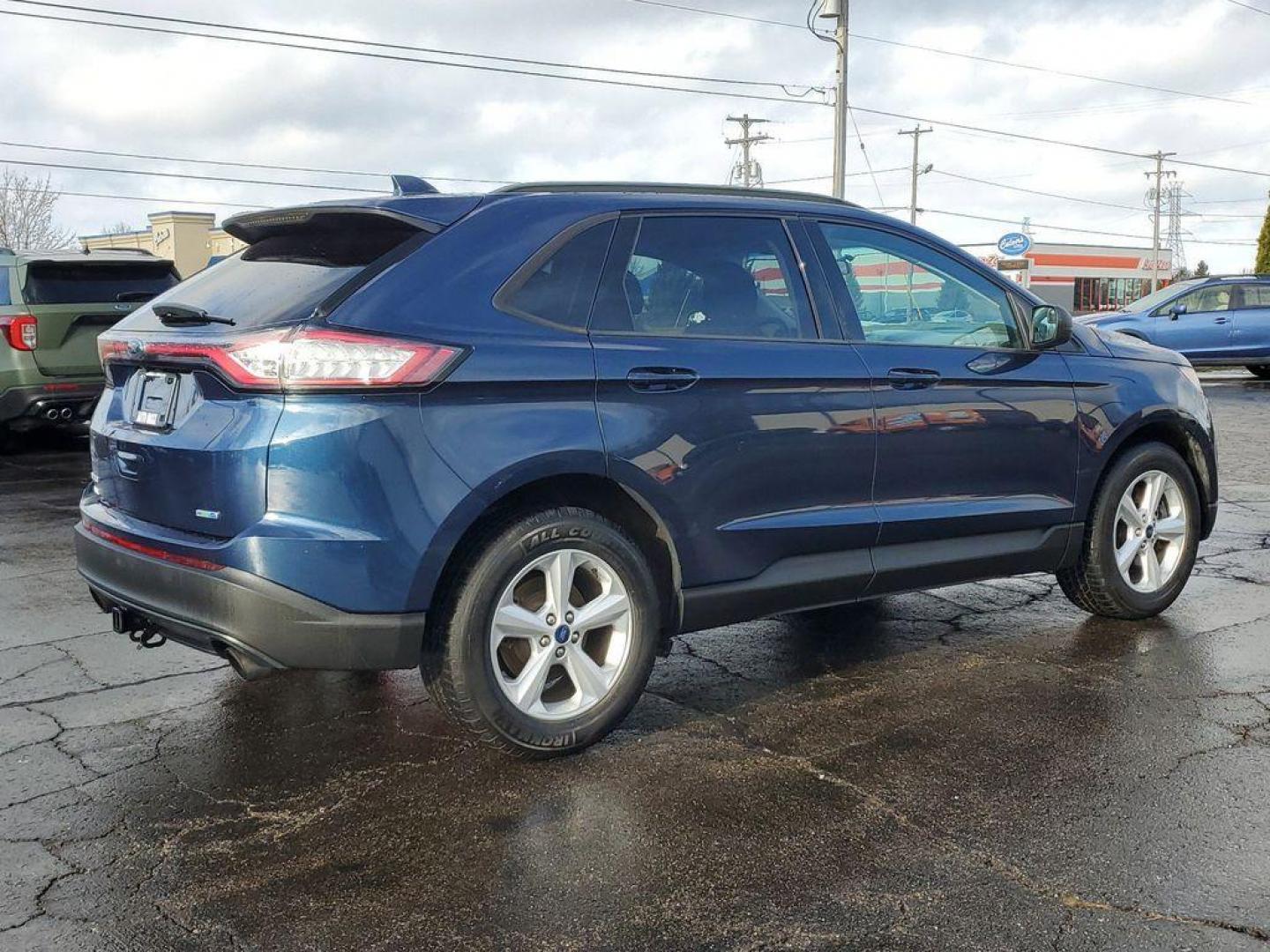 2017 Blue Jeans Metallic /Ebony Ford Edge SE AWD (2FMPK4G93HB) with an 2.0L L4 DOHC 16V engine, 6A transmission, located at 6064 Gull Rd, Kalamazoo, MI, 49048, (269) 222-0088, 42.328388, -85.512924 - Introducing the 2017 Ford Edge SE with All-Wheel Drive, a robust and stylish SUV designed to meet the demands of both city driving and weekend adventures. This model is powered by a fuel-efficient 4-cylinder, 2.0L EcoBoost engine, ensuring a dynamic yet economical driving experience. <br><br>Meticul - Photo#3