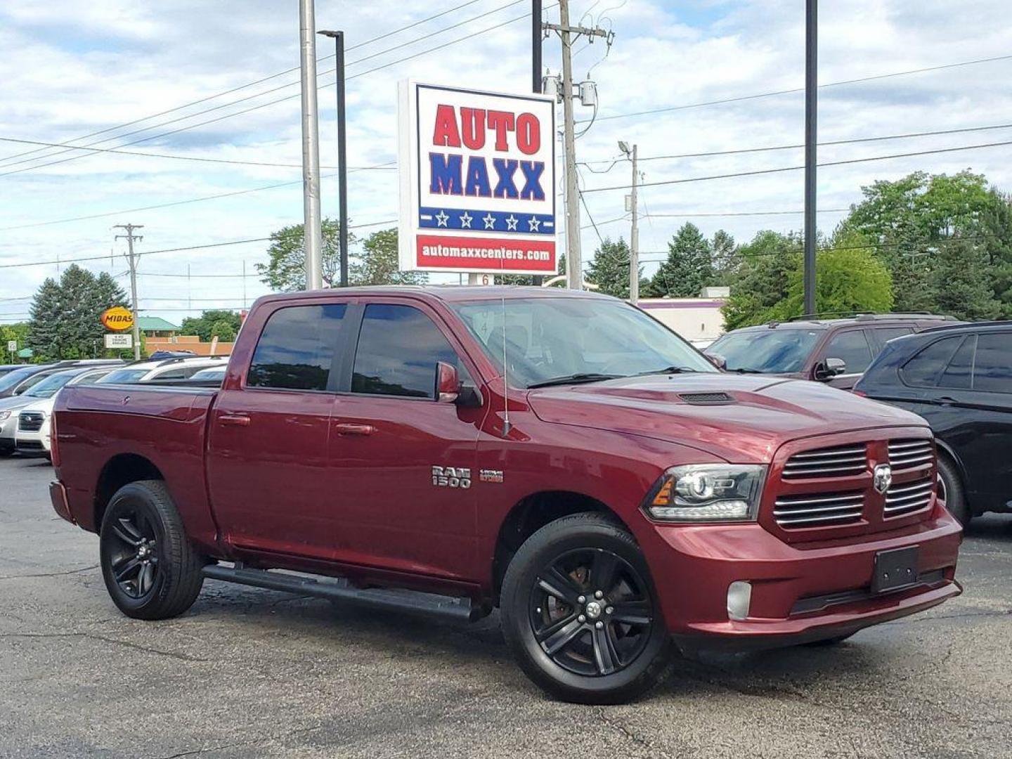 2017 Red Pearl /Black RAM 1500 Sport Crew Cab SWB 4WD (1C6RR7MT0HS) with an 5.7L V8 OHV 16V engine, 8A transmission, located at 6064 Gull Rd, Kalamazoo, MI, 49048, (269) 222-0088, 42.328388, -85.512924 - <b>Vehicle Details</b><br>Introducing the 2017 Ram 1500 Sport, a robust and versatile pickup designed to meet the demands of both work and play. This 4WD powerhouse is equipped with a formidable 5.7L V8 engine, delivering impressive performance and reliability. The Ram 1500 Sport seamlessly blends s - Photo#0