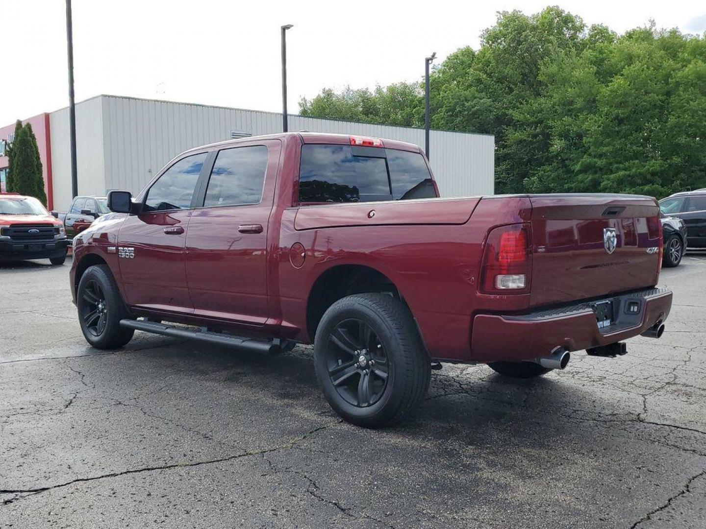 2017 Red Pearl /Black RAM 1500 Sport Crew Cab SWB 4WD (1C6RR7MT0HS) with an 5.7L V8 OHV 16V engine, 8A transmission, located at 6064 Gull Rd, Kalamazoo, MI, 49048, (269) 222-0088, 42.328388, -85.512924 - <b>Vehicle Details</b><br>Introducing the 2017 Ram 1500 Sport, a robust and versatile pickup designed to meet the demands of both work and play. This 4WD powerhouse is equipped with a formidable 5.7L V8 engine, delivering impressive performance and reliability. The Ram 1500 Sport seamlessly blends s - Photo#2