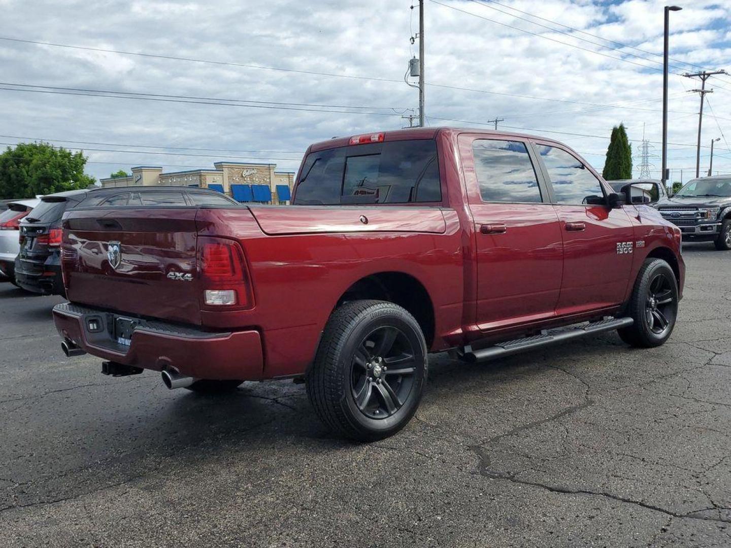 2017 Red Pearl /Black RAM 1500 Sport Crew Cab SWB 4WD (1C6RR7MT0HS) with an 5.7L V8 OHV 16V engine, 8A transmission, located at 6064 Gull Rd, Kalamazoo, MI, 49048, (269) 222-0088, 42.328388, -85.512924 - <b>Vehicle Details</b><br>Introducing the 2017 Ram 1500 Sport, a robust and versatile pickup designed to meet the demands of both work and play. This 4WD powerhouse is equipped with a formidable 5.7L V8 engine, delivering impressive performance and reliability. The Ram 1500 Sport seamlessly blends s - Photo#3