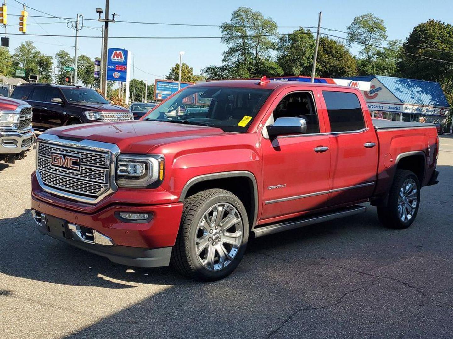 2018 Red Quartz Tintcoat /Jet Black GMC Sierra 1500 Denali Crew Cab Long Box 4WD (3GTU2PEJ9JG) with an 6.2L V8 OHV 16V engine, 6A transmission, located at 234 Columbia Ave, Battle Creek, MI, 49015, (269) 222-0088, 42.298264, -85.192543 - <b>Vehicle Details</b><br>Discover the power and luxury of the 2018 GMC Sierra 1500 Denali at our dealership. This pre-owned gem comes equipped with a robust V8, 6.2L engine and 4WD, ensuring you have the muscle and traction needed for any adventure or tough job. Step inside to experience true com - Photo#3