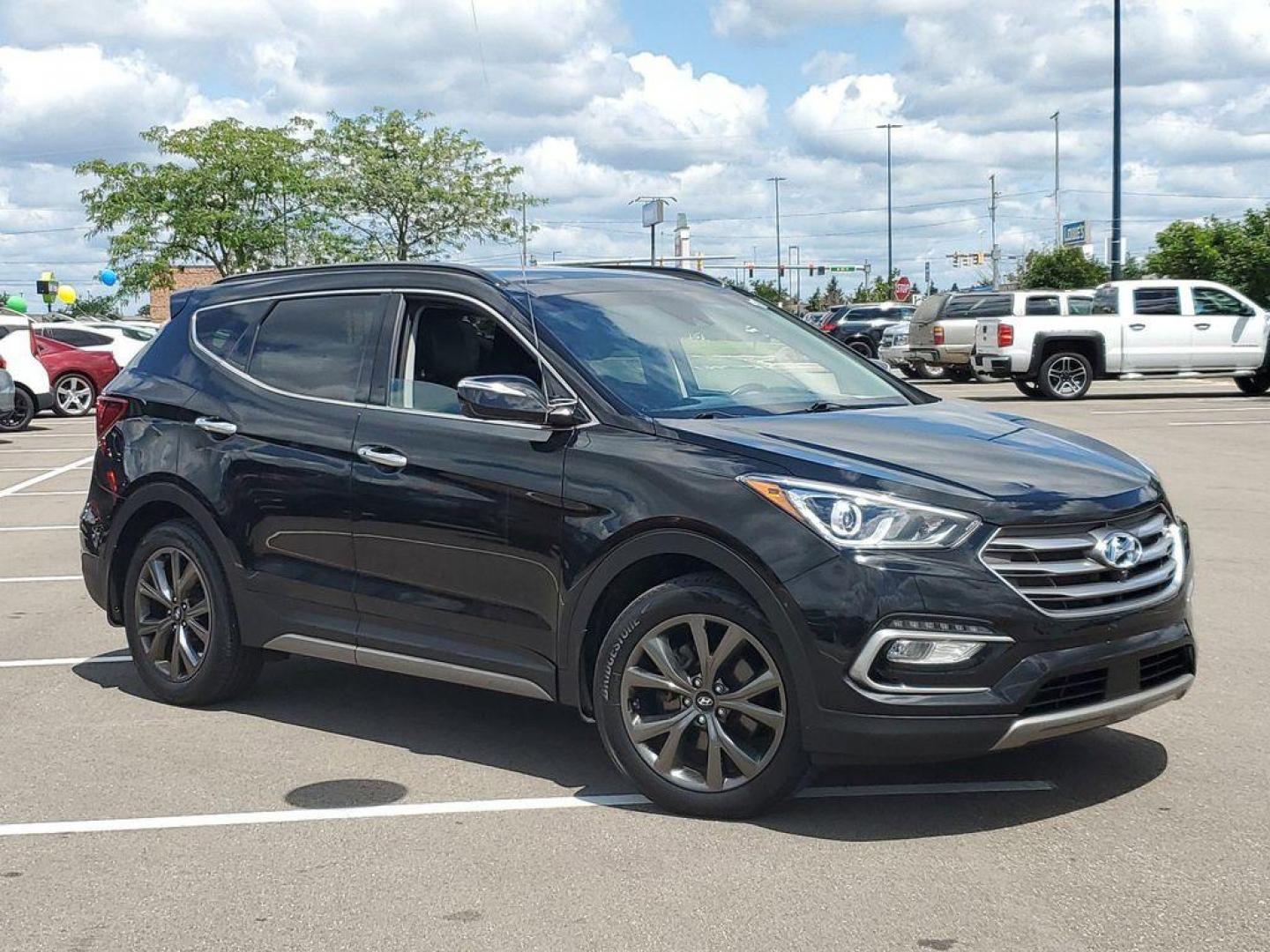 2018 Twilight Black /Black Hyundai Santa Fe Sport 2.0T AWD (5XYZWDLA6JG) with an 2.0L L4 DOHC 16V TURBO engine, 6A transmission, located at 234 Columbia Ave, Battle Creek, MI, 49015, (269) 222-0088, 42.298264, -85.192543 - <b>Vehicle Details</b><br>Discover the ultimate driving experience with this stunning 2018 Hyundai Santa Fe Sport 2.0T Ultimate with AWD! This exceptional SUV combines power, style, and advanced technology to elevate every journey. Beneath the hood, the robust L4, 2.0L engine delivers an exhilaratin - Photo#0