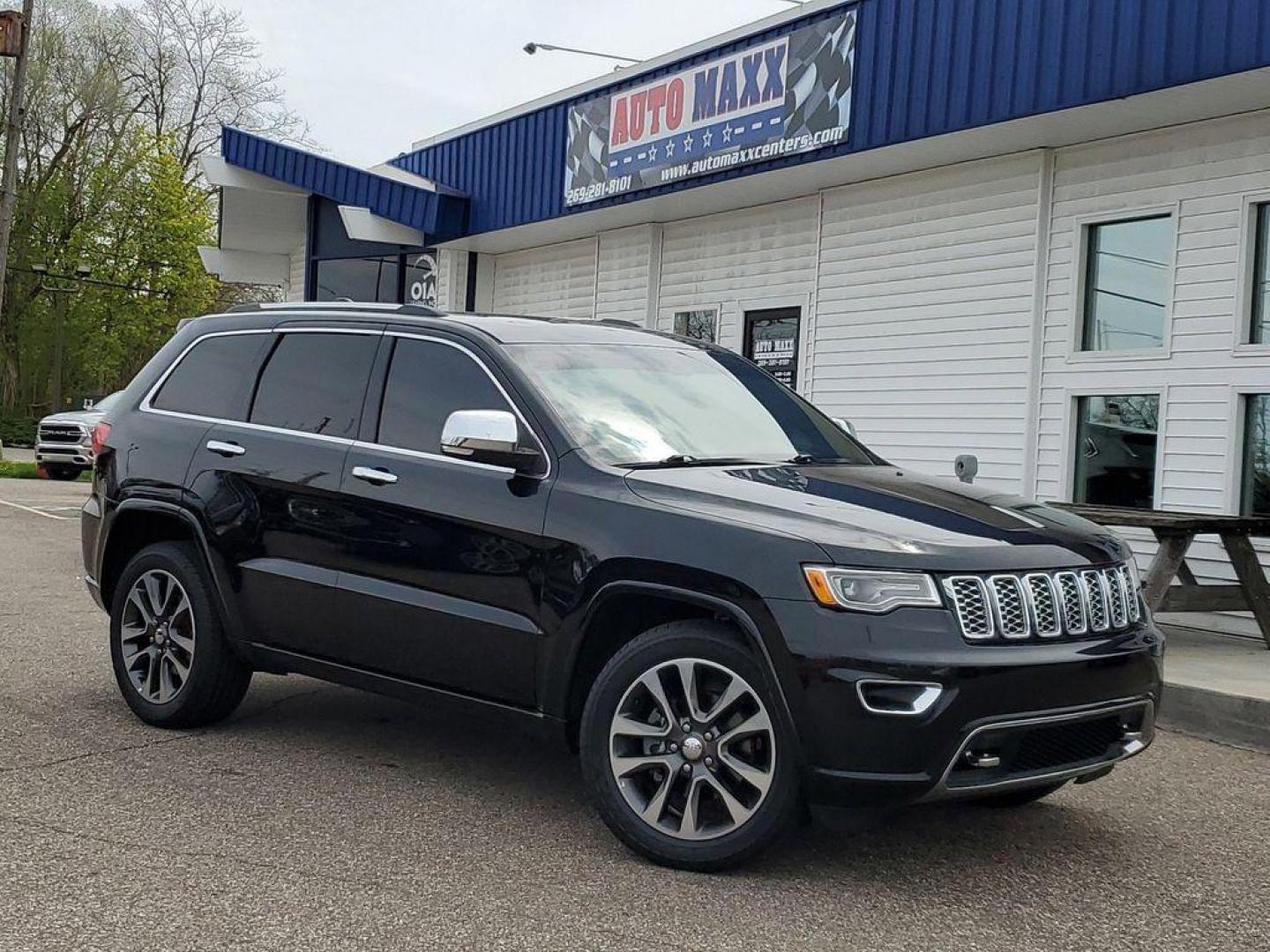 2018 Diamond Black Crystal Pearlcoat /Black Jeep Grand Cherokee Overland 4WD (1C4RJFCG7JC) with an 3.6L V6 DOHC 24V engine, 8A transmission, located at 234 Columbia Ave, Battle Creek, MI, 49015, (269) 222-0088, 42.298264, -85.192543 - <b>Vehicle Details</b><br>Looking for a reliable SUV with top-of-the-line features? Check out this 2018 Jeep Grand Cherokee Overland with only 61344 miles on it! This beauty comes equipped with a powerful V6, 3.6L engine and 4WD, making it perfect for any adventure you have in mind. Inside, you'll - Photo#0