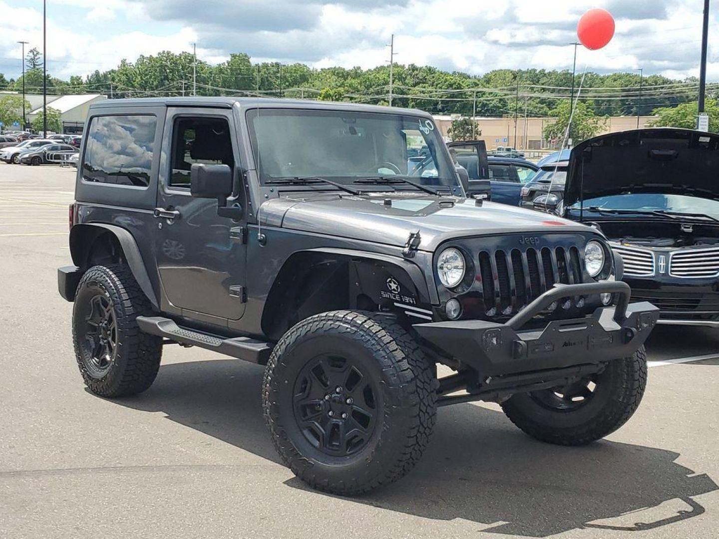 2018 Granite Crystal Metallic Clearcoat /Black Jeep Wrangler Sport 4WD (1C4AJWAG0JL) with an 3.6L V6 DOHC 24V FFV engine, 5-speed automatic transmission, located at 234 Columbia Ave, Battle Creek, MI, 49015, (269) 222-0088, 42.298264, -85.192543 - Discover the epitome of rugged capability with this 2018 Jeep Wrangler JK Willys Wheeler W, now available at our dealership. This iconic 4WD off-road vehicle is powered by a robust 3.6L V6 engine, delivering a perfect blend of performance and reliability for any adventure. With its distinctive Willy - Photo#0