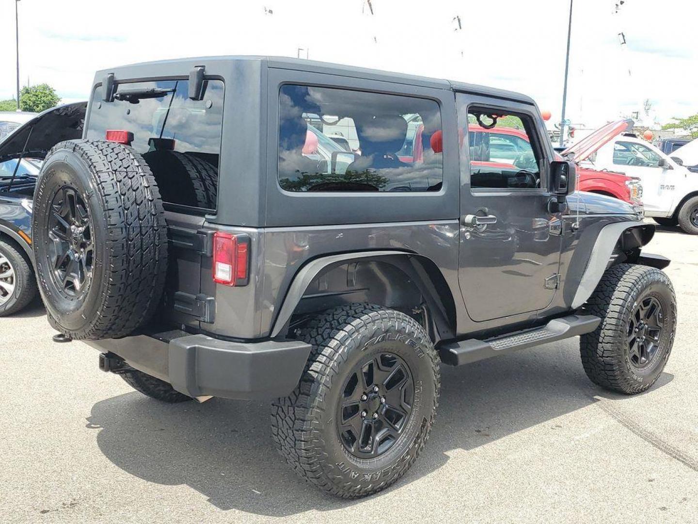 2018 Granite Crystal Metallic Clearcoat /Black Jeep Wrangler Sport 4WD (1C4AJWAG0JL) with an 3.6L V6 DOHC 24V FFV engine, 5-speed automatic transmission, located at 234 Columbia Ave, Battle Creek, MI, 49015, (269) 222-0088, 42.298264, -85.192543 - Discover the epitome of rugged capability with this 2018 Jeep Wrangler JK Willys Wheeler W, now available at our dealership. This iconic 4WD off-road vehicle is powered by a robust 3.6L V6 engine, delivering a perfect blend of performance and reliability for any adventure. With its distinctive Willy - Photo#1