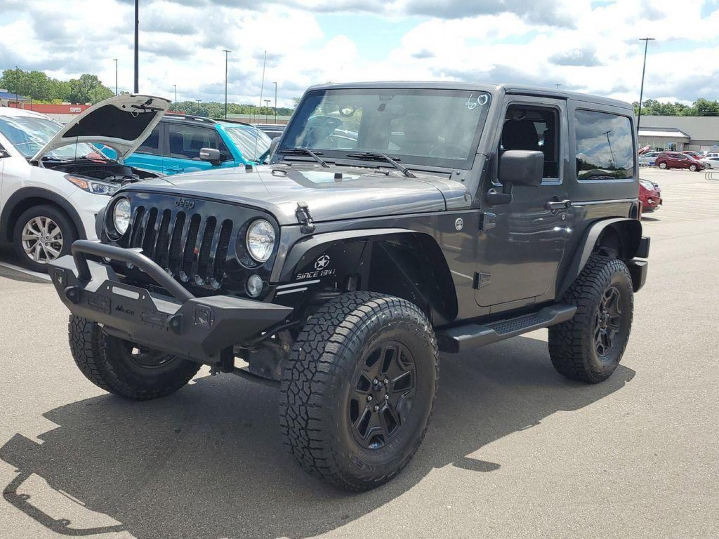 2018 Granite Crystal Metallic Clearcoat /Black Jeep Wrangler Sport 4WD (1C4AJWAG0JL) with an 3.6L V6 DOHC 24V FFV engine, 5-speed automatic transmission, located at 234 Columbia Ave, Battle Creek, MI, 49015, (269) 222-0088, 42.298264, -85.192543 - Discover the epitome of rugged capability with this 2018 Jeep Wrangler JK Willys Wheeler W, now available at our dealership. This iconic 4WD off-road vehicle is powered by a robust 3.6L V6 engine, delivering a perfect blend of performance and reliability for any adventure. With its distinctive Willy - Photo#3