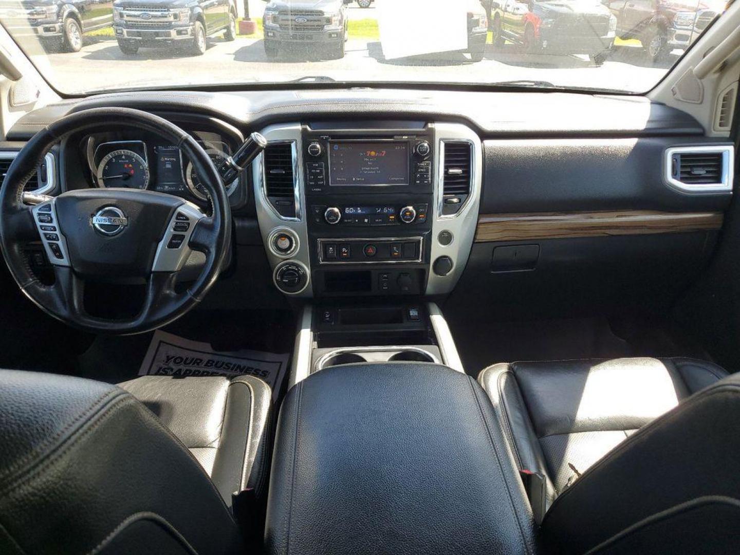 2018 Gun Metallic /Black Nissan Titan PRO-4X Crew Cab 4WD (1N6AA1E55JN) with an 5.6L V8 DOHC 32V engine, 6A transmission, located at 6064 Gull Rd, Kalamazoo, MI, 49048, (269) 222-0088, 42.328388, -85.512924 - Experience the perfect blend of power, luxury, and reliability with this remarkable 2018 Nissan Titan SL 4WD! This rugged yet refined pickup is designed to tackle any terrain with its robust V8, 5.6L engine, delivering an impressive 390 horsepower and 394 lb-ft of torque. Whether you're hauling heav - Photo#10