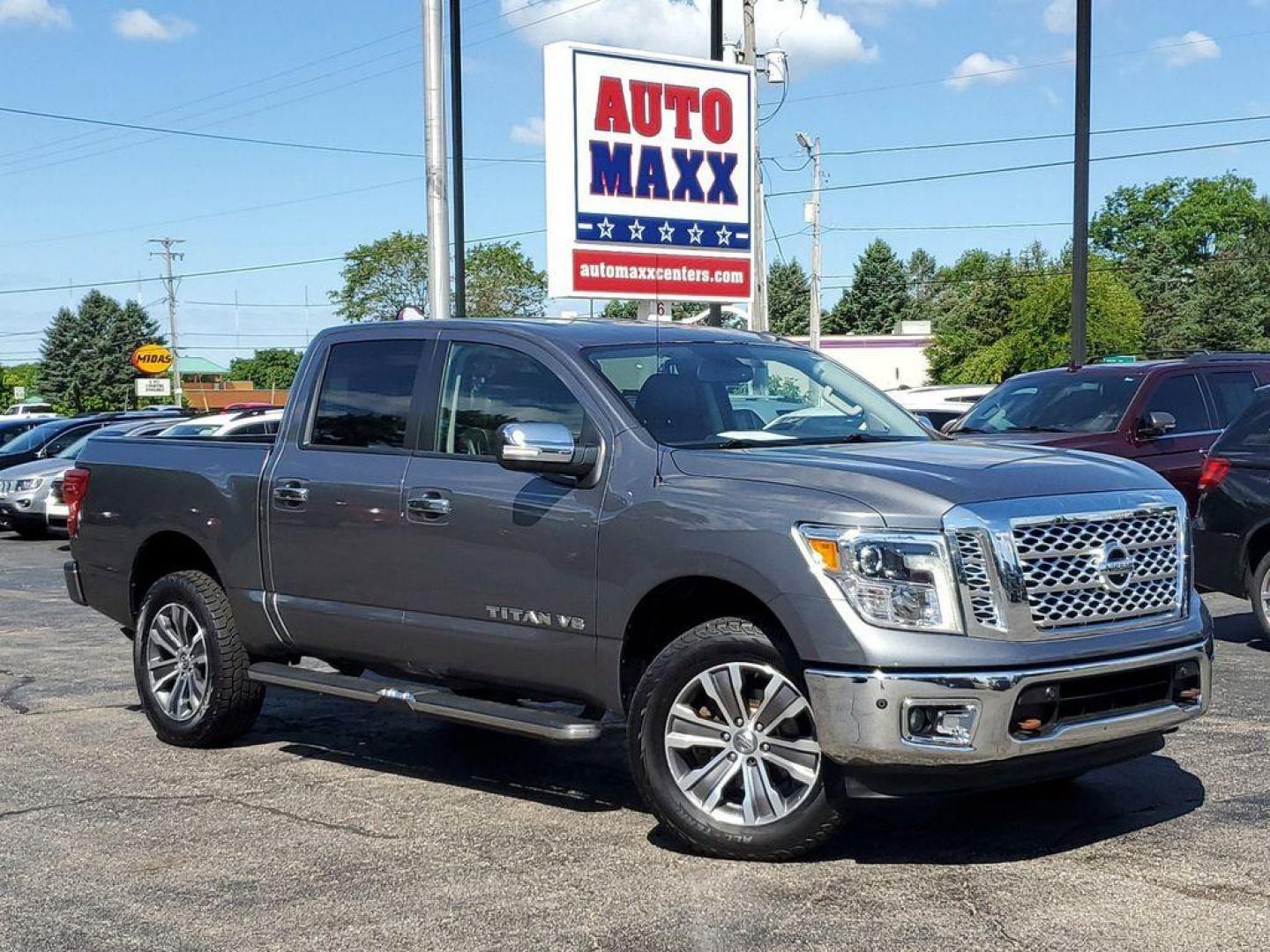 2018 Gun Metallic /Black Nissan Titan PRO-4X Crew Cab 4WD (1N6AA1E55JN) with an 5.6L V8 DOHC 32V engine, 6A transmission, located at 6064 Gull Rd, Kalamazoo, MI, 49048, (269) 222-0088, 42.328388, -85.512924 - Experience the perfect blend of power, luxury, and reliability with this remarkable 2018 Nissan Titan SL 4WD! This rugged yet refined pickup is designed to tackle any terrain with its robust V8, 5.6L engine, delivering an impressive 390 horsepower and 394 lb-ft of torque. Whether you're hauling heav - Photo#0