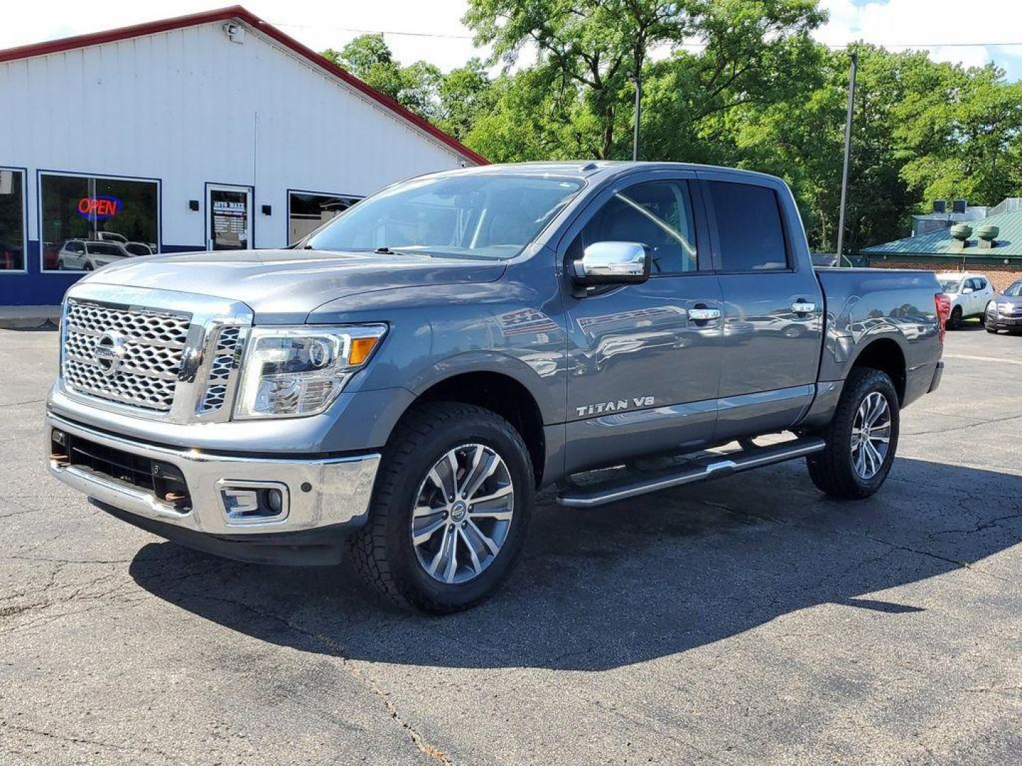 2018 Gun Metallic /Black Nissan Titan PRO-4X Crew Cab 4WD (1N6AA1E55JN) with an 5.6L V8 DOHC 32V engine, 6A transmission, located at 6064 Gull Rd, Kalamazoo, MI, 49048, (269) 222-0088, 42.328388, -85.512924 - Experience the perfect blend of power, luxury, and reliability with this remarkable 2018 Nissan Titan SL 4WD! This rugged yet refined pickup is designed to tackle any terrain with its robust V8, 5.6L engine, delivering an impressive 390 horsepower and 394 lb-ft of torque. Whether you're hauling heav - Photo#1