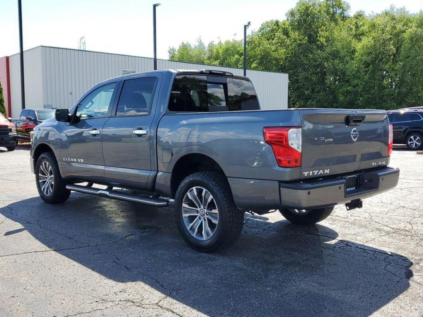 2018 Gun Metallic /Black Nissan Titan PRO-4X Crew Cab 4WD (1N6AA1E55JN) with an 5.6L V8 DOHC 32V engine, 6A transmission, located at 6064 Gull Rd, Kalamazoo, MI, 49048, (269) 222-0088, 42.328388, -85.512924 - Experience the perfect blend of power, luxury, and reliability with this remarkable 2018 Nissan Titan SL 4WD! This rugged yet refined pickup is designed to tackle any terrain with its robust V8, 5.6L engine, delivering an impressive 390 horsepower and 394 lb-ft of torque. Whether you're hauling heav - Photo#2