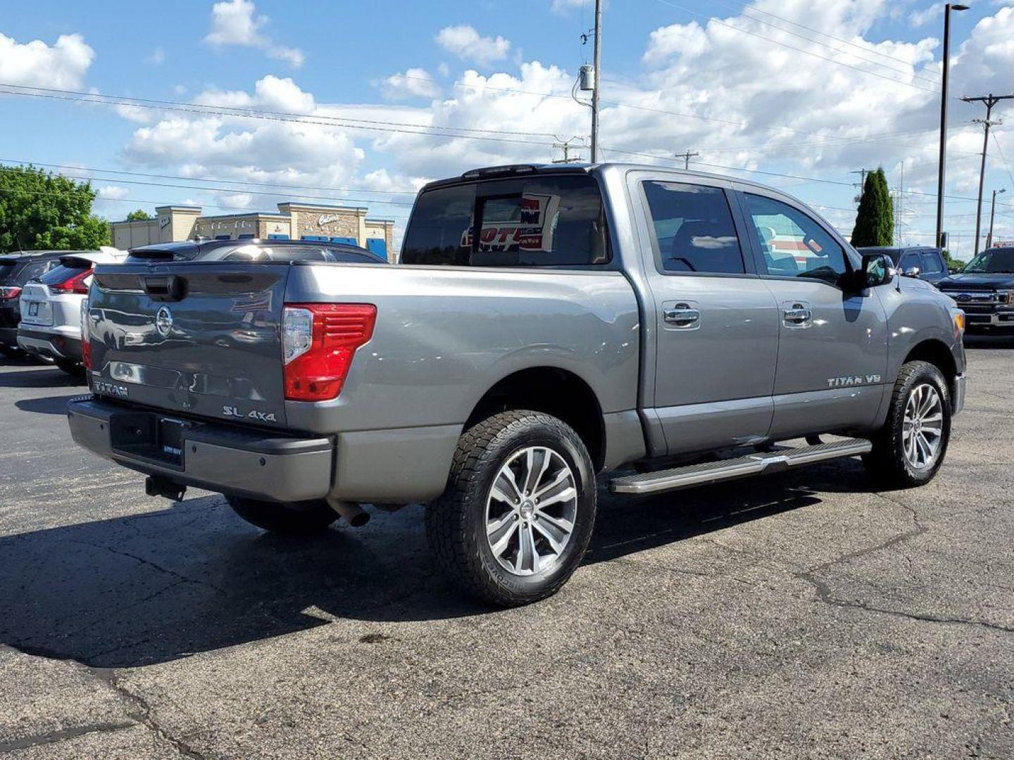 2018 Gun Metallic /Black Nissan Titan PRO-4X Crew Cab 4WD (1N6AA1E55JN) with an 5.6L V8 DOHC 32V engine, 6A transmission, located at 6064 Gull Rd, Kalamazoo, MI, 49048, (269) 222-0088, 42.328388, -85.512924 - Experience the perfect blend of power, luxury, and reliability with this remarkable 2018 Nissan Titan SL 4WD! This rugged yet refined pickup is designed to tackle any terrain with its robust V8, 5.6L engine, delivering an impressive 390 horsepower and 394 lb-ft of torque. Whether you're hauling heav - Photo#3