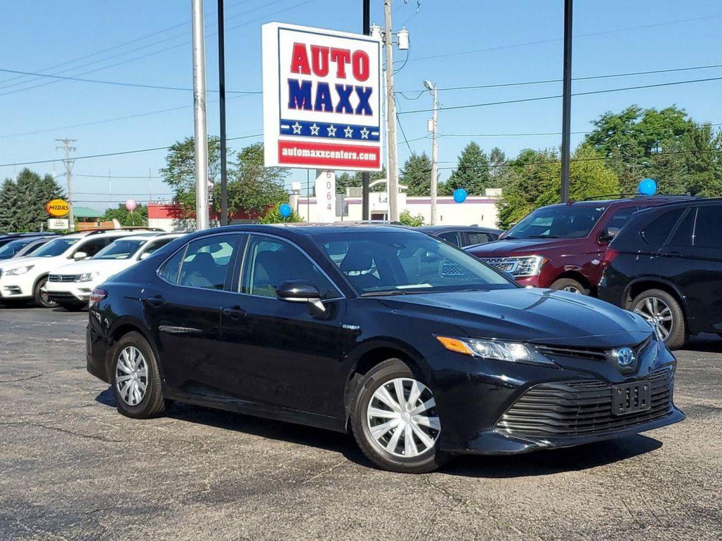 2018 Midnight Black Metallic /Black Toyota Camry Hybrid XLE (4T1B31HK5JU) with an 2.5L L4 DOHC 16V HYBRID engine, CVT transmission, located at 6064 Gull Rd, Kalamazoo, MI, 49048, (269) 222-0088, 42.328388, -85.512924 - <b>Vehicle Details</b><br>For sale at our dealership, we present a meticulously maintained 2018 Toyota Camry Hybrid LE with front-wheel drive and a powerful L4, 2.5L engine. This reliable sedan combines exceptional fuel efficiency with a smooth driving experience, making it an excellent choice for d - Photo#0