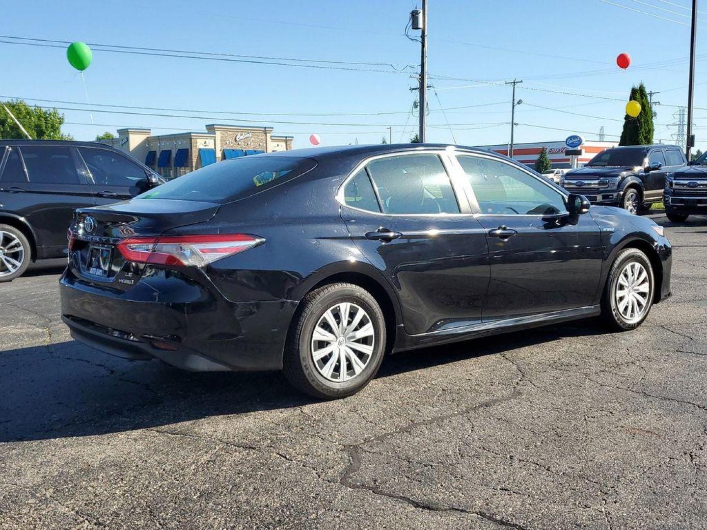 2018 Midnight Black Metallic /Black Toyota Camry Hybrid XLE (4T1B31HK5JU) with an 2.5L L4 DOHC 16V HYBRID engine, CVT transmission, located at 6064 Gull Rd, Kalamazoo, MI, 49048, (269) 222-0088, 42.328388, -85.512924 - <b>Vehicle Details</b><br>For sale at our dealership, we present a meticulously maintained 2018 Toyota Camry Hybrid LE with front-wheel drive and a powerful L4, 2.5L engine. This reliable sedan combines exceptional fuel efficiency with a smooth driving experience, making it an excellent choice for d - Photo#3