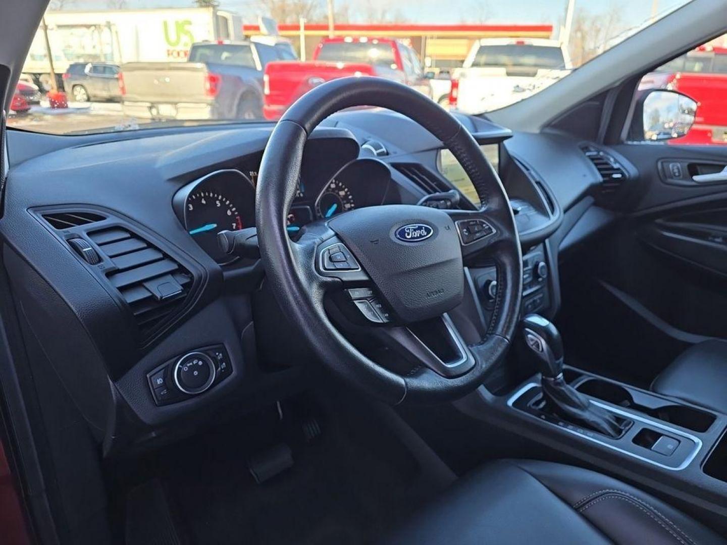 2019 Ruby Red Metallic Tinted Clearcoat /Charcoal Black Ford Escape SEL 4WD (1FMCU9HD2KU) with an 1.5L L4 DOHC 16V engine, 6A transmission, located at 234 Columbia Ave, Battle Creek, MI, 49015, (269) 222-0088, 42.298264, -85.192543 - When you encounter slick or muddy roads, you can engage the four wheel drive on the Ford Escape and drive with confidence. This small suv comes equipped with Android Auto for seamless smartphone integration on the road. Apple CarPlay: Seamless smartphone integration for this vehicle - stay connected - Photo#14