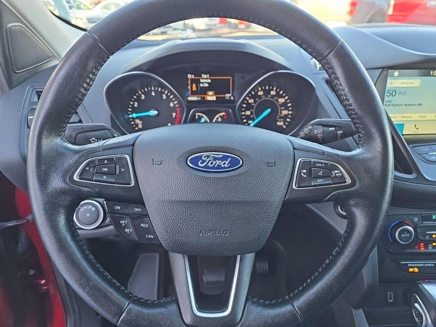 2019 Ruby Red Metallic Tinted Clearcoat /Charcoal Black Ford Escape SEL 4WD (1FMCU9HD2KU) with an 1.5L L4 DOHC 16V engine, 6A transmission, located at 234 Columbia Ave, Battle Creek, MI, 49015, (269) 222-0088, 42.298264, -85.192543 - When you encounter slick or muddy roads, you can engage the four wheel drive on the Ford Escape and drive with confidence. This small suv comes equipped with Android Auto for seamless smartphone integration on the road. Apple CarPlay: Seamless smartphone integration for this vehicle - stay connected - Photo#16