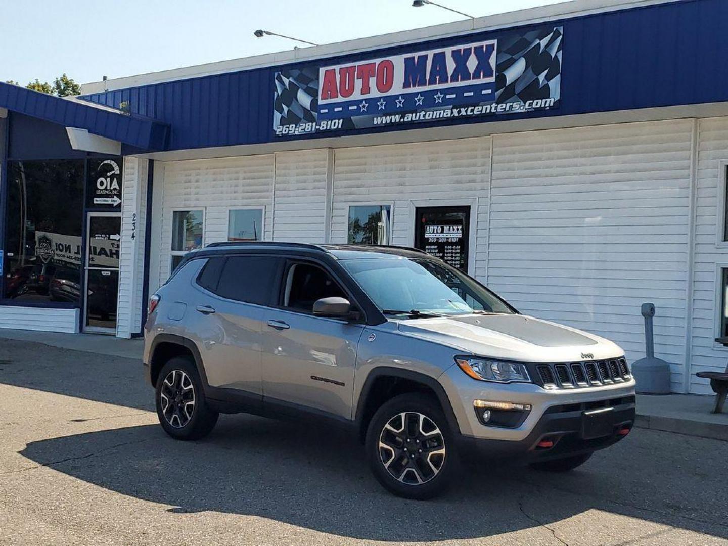 2019 Billet Silver Metallic Clearcoat /Ruby Red/Black Jeep Compass Trailhawk 4WD (3C4NJDDB8KT) with an 2.4L L4 DOHC 16V engine, 9A transmission, located at 234 Columbia Ave, Battle Creek, MI, 49015, (269) 222-0088, 42.298264, -85.192543 - <b>Vehicle Details</b><br>Discover the exceptional 2019 Jeep Compass Trailhawk, a versatile SUV designed for both urban driving and off-road adventures. Equipped with a robust 4WD system and a dependable 4-cylinder, 2.4L engine, this vehicle delivers impressive performance and handling in a variety - Photo#0