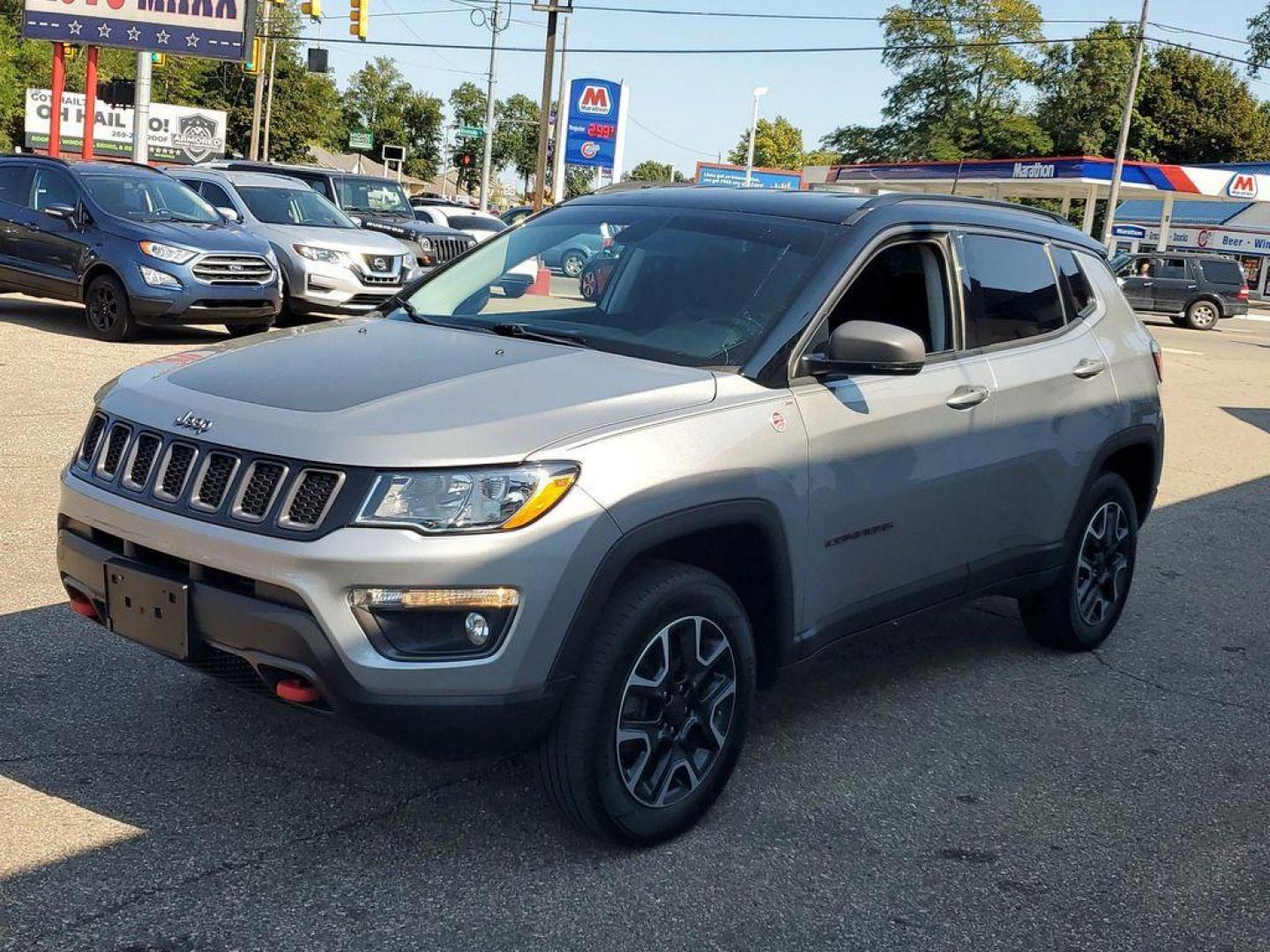 2019 Billet Silver Metallic Clearcoat /Ruby Red/Black Jeep Compass Trailhawk 4WD (3C4NJDDB8KT) with an 2.4L L4 DOHC 16V engine, 9A transmission, located at 234 Columbia Ave, Battle Creek, MI, 49015, (269) 222-0088, 42.298264, -85.192543 - <b>Vehicle Details</b><br>Discover the exceptional 2019 Jeep Compass Trailhawk, a versatile SUV designed for both urban driving and off-road adventures. Equipped with a robust 4WD system and a dependable 4-cylinder, 2.4L engine, this vehicle delivers impressive performance and handling in a variety - Photo#3