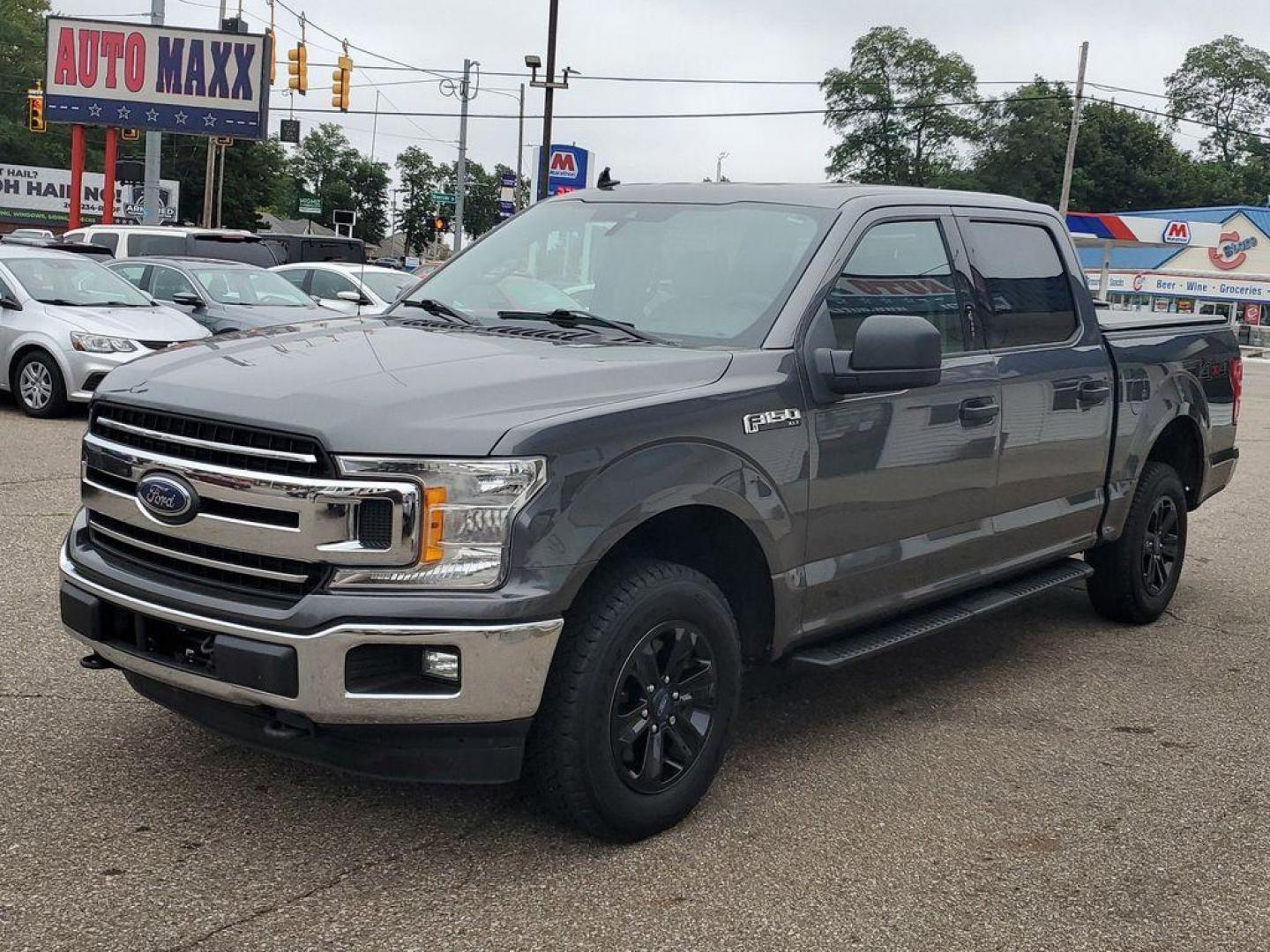 2020 Magnetic /Medium Earth Grey Ford F-150 XLT SuperCrew 6.5-ft. Bed 4WD (1FTEW1E43LF) with an 3.5L V6 TURBO engine, 6A transmission, located at 234 Columbia Ave, Battle Creek, MI, 49015, (269) 222-0088, 42.298264, -85.192543 - <b>Vehicle Details</b><br>Introducing the exceptional 2020 Ford F-150 XLT, now available at our esteemed dealership. This impressive used pickup truck combines raw power with advanced features, making it the perfect choice for both work and leisure. With a remarkable 119,811 miles on the odometer, t - Photo#3