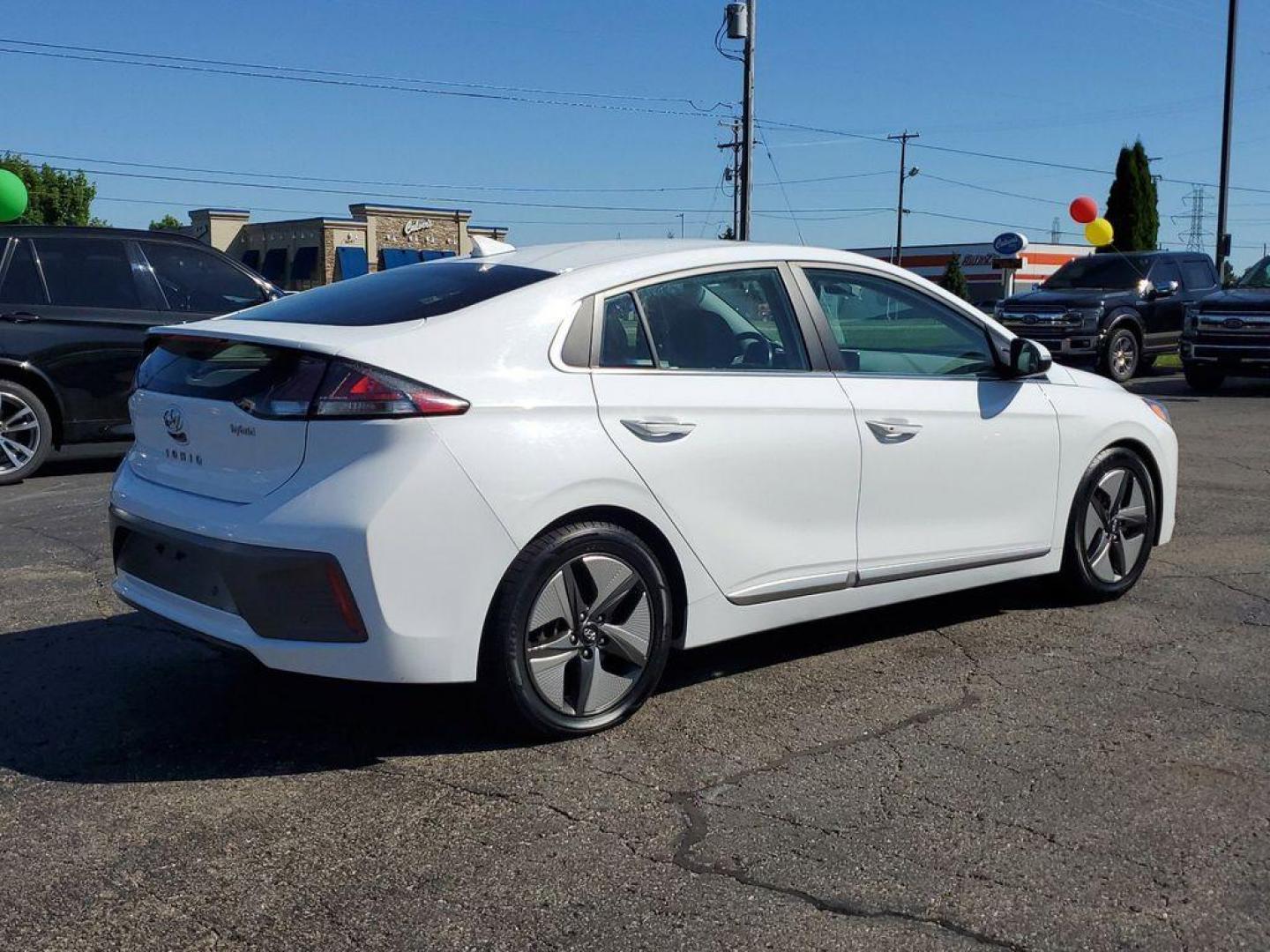 2020 Ceramic White /Gray Hyundai Ioniq Hybrid Limited (KMHC05LC5LU) with an 1.6L L4 DOHC 16V HYBRID engine, 6A transmission, located at 6064 Gull Rd, Kalamazoo, MI, 49048, (269) 222-0088, 42.328388, -85.512924 - <b>Vehicle Details</b><br>Presenting the 2020 Hyundai IONIQ Hybrid Limited, a sophisticated blend of efficiency and advanced technology. This meticulously maintained vehicle, featuring front-wheel drive and powered by a 1.6L L4 engine, offers an exceptional driving experience. The IONIQ Hybrid Limit - Photo#3