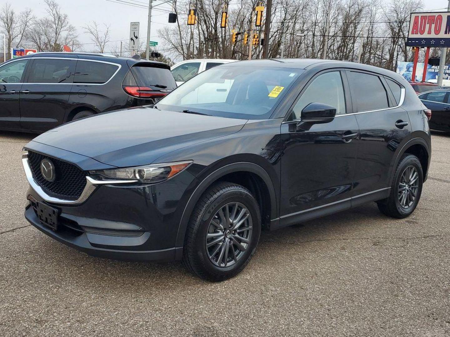 2020 Jet Black Mica /Black Mazda CX-5 Touring AWD (JM3KFBCM9L0) with an 2.5L L4 DOHC 16V engine, 6A transmission, located at 234 Columbia Ave, Battle Creek, MI, 49015, (269) 222-0088, 42.298264, -85.192543 - <b>Vehicle Details</b><br>Introducing the 2020 Mazda CX-5 Touring AWD, a perfect blend of performance, style, and modern technology. This exceptional SUV, powered by a 2.5L 4-cylinder engine, offers a dynamic driving experience with impressive fuel efficiency. The all-wheel-drive system ensures conf - Photo#3