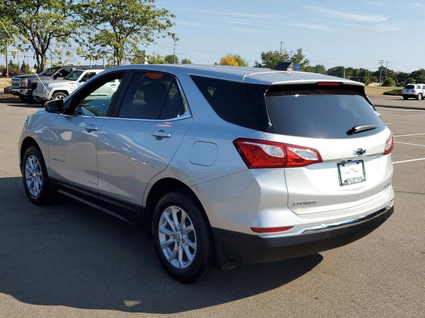 2021 Silver Ice Metallic /Jet Black Chevrolet Equinox LT AWD (3GNAXUEV8MS) with an 1.5L L4 DOHC 16V TURBO engine, 6A transmission, located at 234 Columbia Ave, Battle Creek, MI, 49015, (269) 222-0088, 42.298264, -85.192543 - <b>Vehicle Details</b><br>Introducing the 2021 Chevrolet Equinox LT, a well-maintained, pre-owned vehicle with 40,718 miles on the odometer. This compact SUV is equipped with a reliable 4-cylinder, 1.5L engine, delivering a balanced combination of power and efficiency, perfect for both city commutes - Photo#2