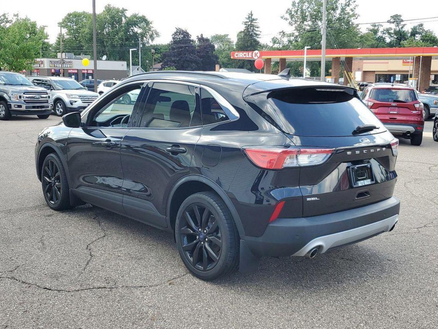 2021 Agate Black Metallic /Ebony Ford Escape SEL (1FMCU0H6XMU) with an 1.5L L3 engine, 6A transmission, located at 6064 Gull Rd, Kalamazoo, MI, 49048, (269) 222-0088, 42.328388, -85.512924 - <b>Vehicle Details</b><br>For Sale: 2021 Ford Escape SEL - A Blend of Style and Performance! Introducing a meticulously maintained 2021 Ford Escape SEL with only 38,121 miles on the odometer. This versatile SUV combines modern technology with dependable performance, making it an ideal choice for fa - Photo#2