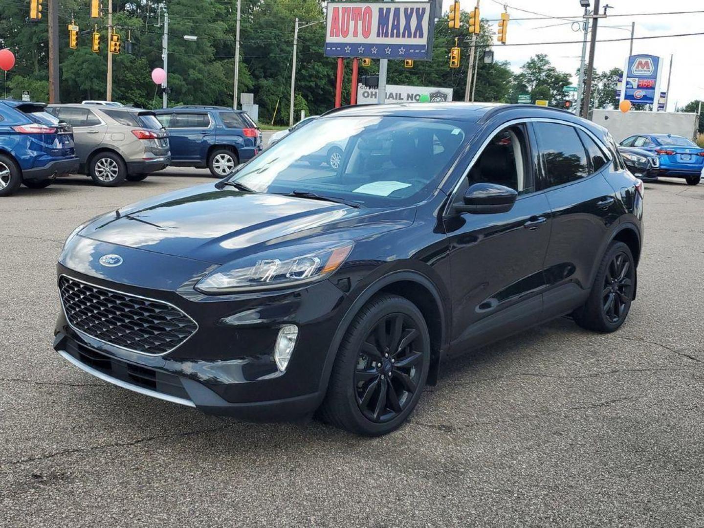 2021 Agate Black Metallic /Ebony Ford Escape SEL (1FMCU0H6XMU) with an 1.5L L3 engine, 6A transmission, located at 6064 Gull Rd, Kalamazoo, MI, 49048, (269) 222-0088, 42.328388, -85.512924 - <b>Vehicle Details</b><br>For Sale: 2021 Ford Escape SEL - A Blend of Style and Performance! Introducing a meticulously maintained 2021 Ford Escape SEL with only 38,121 miles on the odometer. This versatile SUV combines modern technology with dependable performance, making it an ideal choice for fa - Photo#3