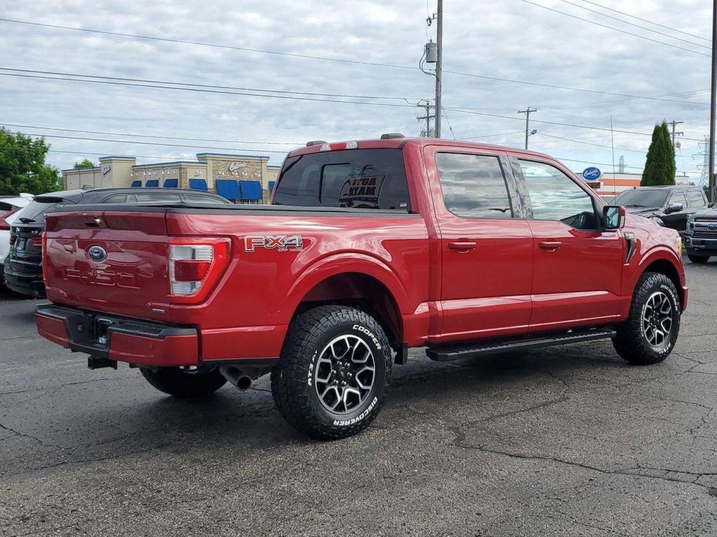 2021 Rapid Red Metallic Tinted Clearcoat /Black Ford F-150 Lariat SuperCrew 5.5-ft. Bed 4WD (1FTFW1E84MK) with an 4.6L V8 SOHC 24V engine, 10-speed automatic transmission, located at 6064 Gull Rd, Kalamazoo, MI, 49048, (269) 222-0088, 42.328388, -85.512924 - <b>Vehicle Details</b><br>Experience the perfect blend of power, luxury, and technology with this stunning pre-owned 2021 Ford F-150 LARIAT! This truck is built to impress, featuring a mighty V6, 3.5L engine that delivers robust performance whether you're on the highway or tackling rugged terrain. T - Photo#3