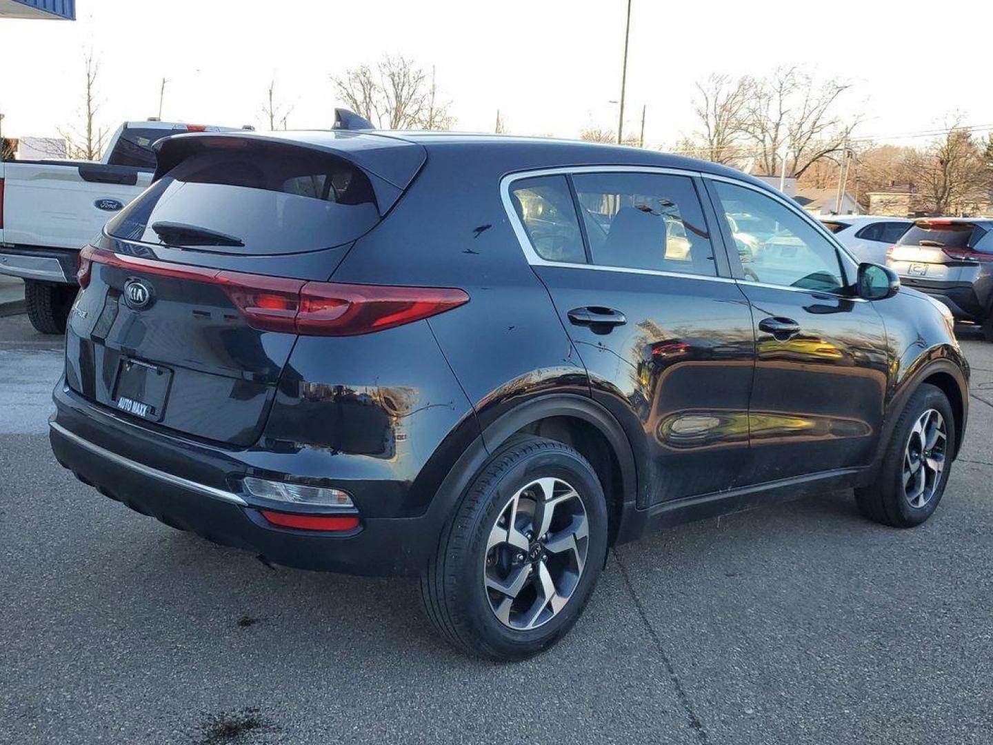 2021 Black Cherry /Black Kia Sportage LX FWD (KNDPM3AC4M7) with an 2.4L V6 DOHC 24V engine, 6A transmission, located at 234 Columbia Ave, Battle Creek, MI, 49015, (269) 222-0088, 42.298264, -85.192543 - <b>Vehicle Details</b><br>For sale: a stylish and reliable 2021 Kia Sportage LX, perfect for those seeking comfort and practicality in their drive. This well-maintained SUV, featuring a Front-Wheel Drive (FWD) configuration, is powered by an efficient 4-cylinder, 2.4L engine, offering a smooth and r - Photo#1