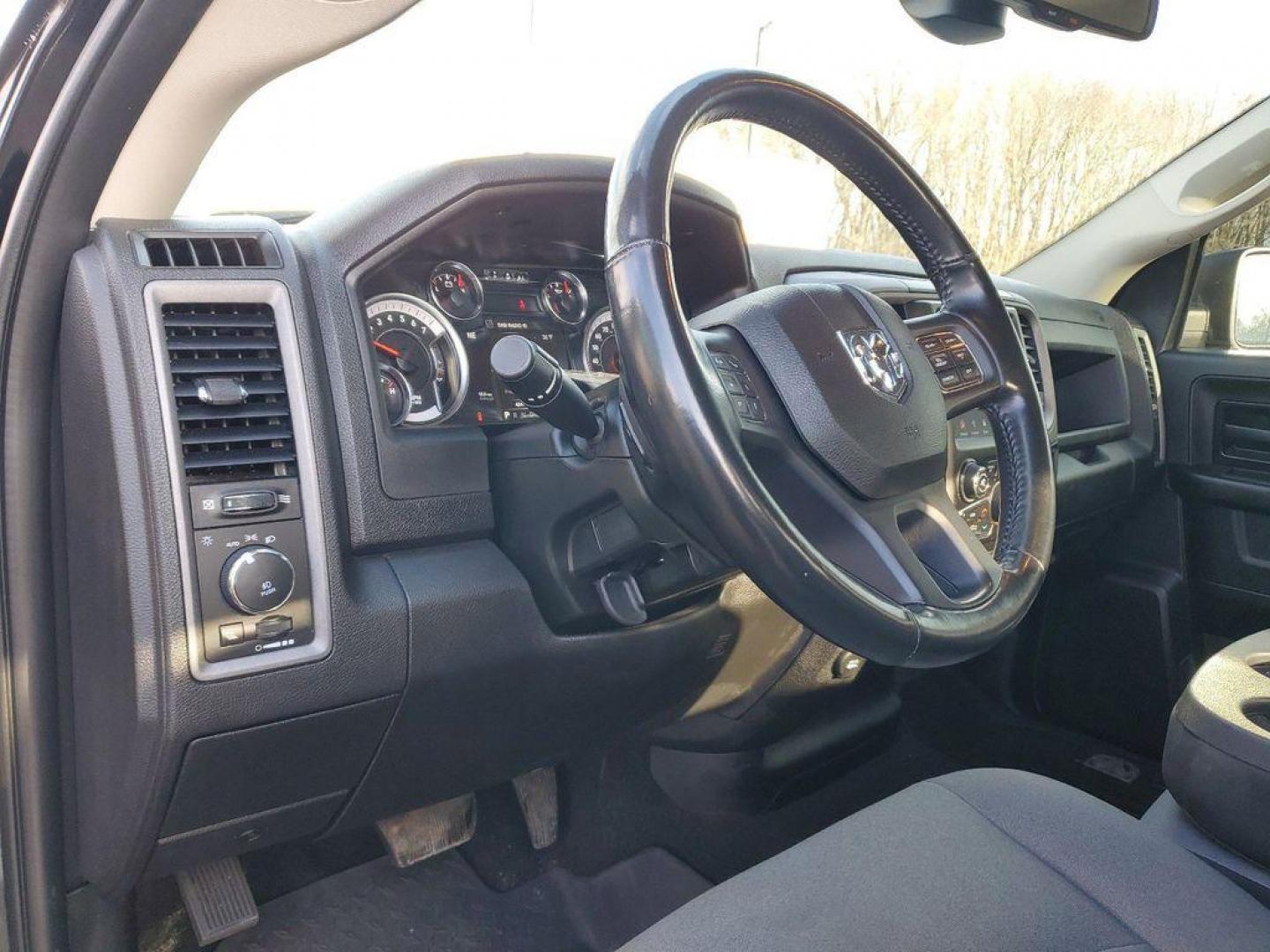 2021 BLACK /GREY RAM 1500 Classic Tradesman Quad Cab 4WD (1C6RR7FG5MS) with an 3.6L V6 DOHC 24V FFV engine, 8A transmission, located at 6064 Gull Rd, Kalamazoo, MI, 49048, (269) 222-0088, 42.328388, -85.512924 - For sale: a robust and reliable 2021 Ram 1500 Classic EXPRESS with just 46,390 miles. Equipped with a powerful V6, 3.6L engine and 4WD, this truck is ready to tackle any adventure, whether you're hitting the trails or cruising on the highway. Experience the perfect blend of comfort and capability.<b - Photo#16