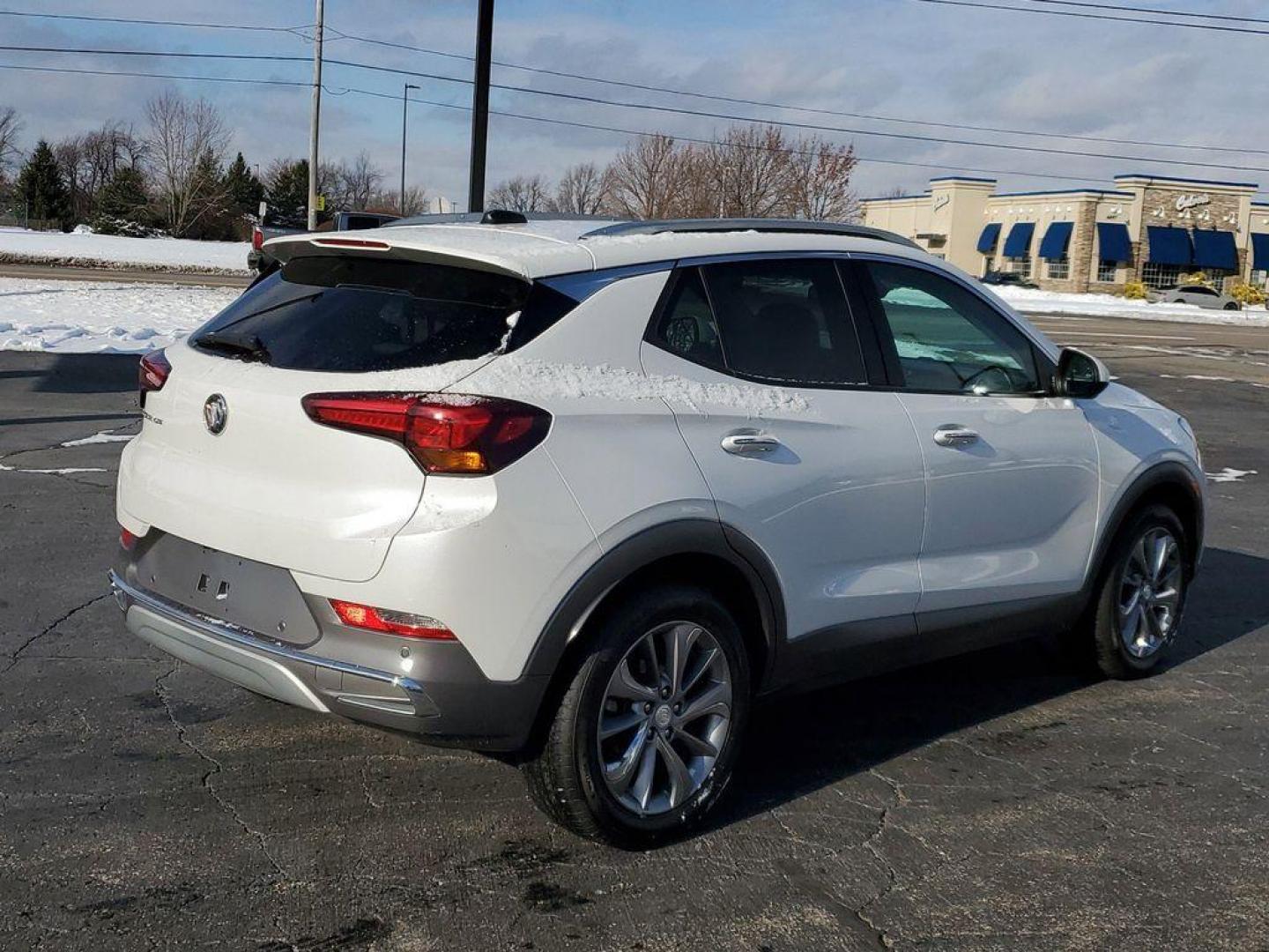 2022 White Frost Tricoat /Whisper Beige w/Ebony Accents Buick Encore GX Essence (KL4MMFSL2NB) with an 1.3L L3 TURBO engine, CVT transmission, located at 6064 Gull Rd, Kalamazoo, MI, 49048, (269) 222-0088, 42.328388, -85.512924 - <b>Vehicle Details</b><br>Discover the epitome of modern sophistication and efficiency with the 2022 Buick Encore GX Essence! This sleek crossover combines luxury with practicality, offering a driving experience that's both exhilarating and comfortable. The heart of this vehicle is its spirited 3-cy - Photo#1