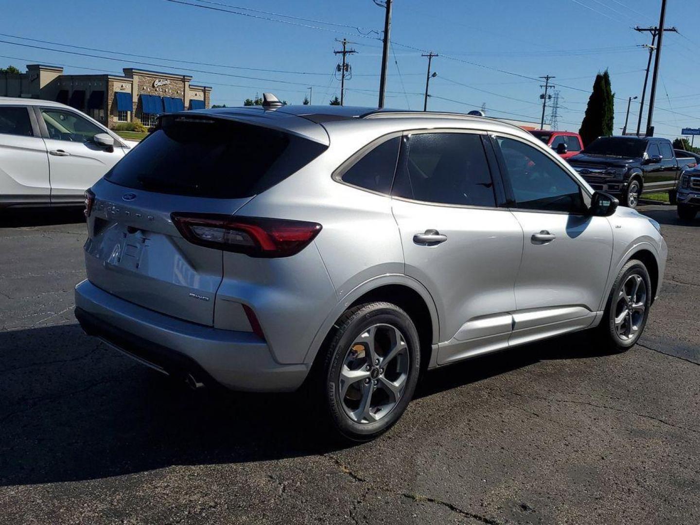 2023 Iconic Silver Metallic /Ebony Ford Escape ST-Line AWD (1FMCU9MN5PU) with an 1.5L L3 engine, 8A transmission, located at 6064 Gull Rd, Kalamazoo, MI, 49048, (269) 222-0088, 42.328388, -85.512924 - <b>Vehicle Details</b><br>Looking for a reliable and stylish SUV? Check out this 2023 Ford Escape ST Line with only 24,006 miles, available now at our dealership. This well-maintained vehicle comes with a CARFAX 1-Owner report, ensuring you are getting a quality car with a clean history. Equipped w - Photo#1