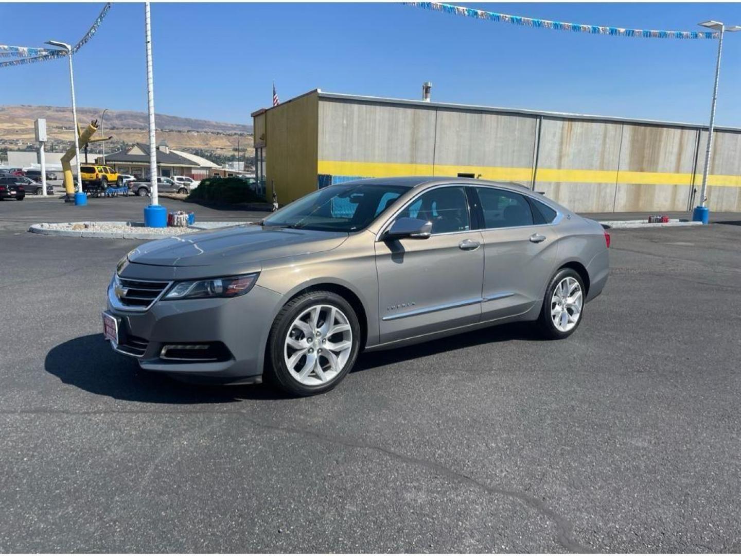 2018 Pepperdust Metallic /Jet Black Chevrolet Impala Premier (2G1125S36J9) with an 3.6L V6 DOHC 24V engine, 6A transmission, located at 6064 Gull Rd, Kalamazoo, MI, 49048, (269) 222-0088, 42.328388, -85.512924 - <b>Equipment</b><br>You'll never again be lost in a crowded city or a country region with the navigation system on this Chevrolet Impala. Engulf yourself with the crystal clear sound of a BOSE sound system in the vehicle. The leather seats in this vehicle are a must for buyers looking for comfort, - Photo#2