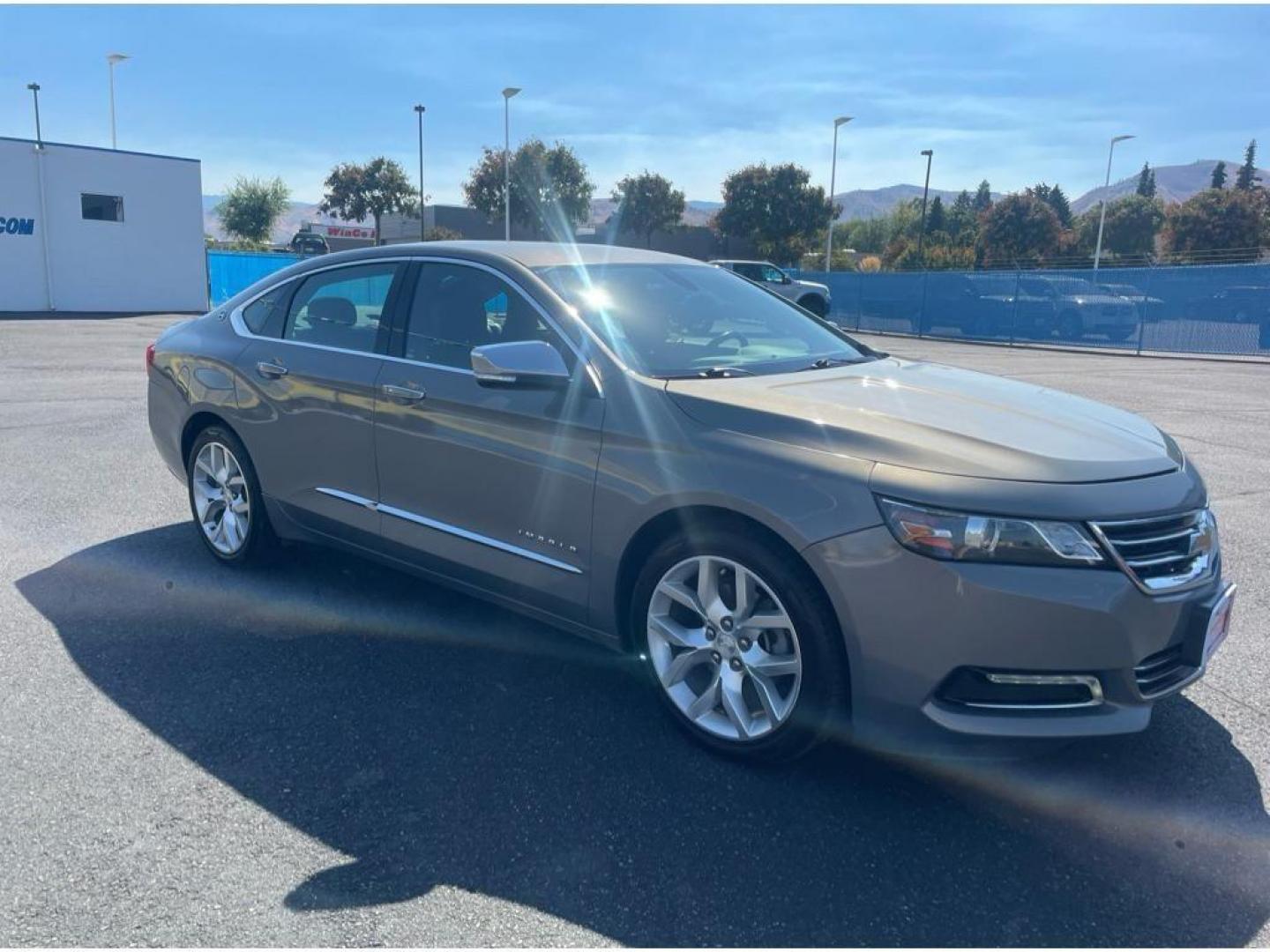 2018 Pepperdust Metallic /Jet Black Chevrolet Impala Premier (2G1125S36J9) with an 3.6L V6 DOHC 24V engine, 6A transmission, located at 6064 Gull Rd, Kalamazoo, MI, 49048, (269) 222-0088, 42.328388, -85.512924 - <b>Equipment</b><br>You'll never again be lost in a crowded city or a country region with the navigation system on this Chevrolet Impala. Engulf yourself with the crystal clear sound of a BOSE sound system in the vehicle. The leather seats in this vehicle are a must for buyers looking for comfort, - Photo#3