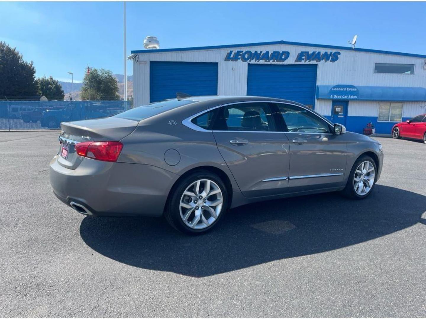 2018 Pepperdust Metallic /Jet Black Chevrolet Impala Premier (2G1125S36J9) with an 3.6L V6 DOHC 24V engine, 6A transmission, located at 6064 Gull Rd, Kalamazoo, MI, 49048, (269) 222-0088, 42.328388, -85.512924 - <b>Equipment</b><br>You'll never again be lost in a crowded city or a country region with the navigation system on this Chevrolet Impala. Engulf yourself with the crystal clear sound of a BOSE sound system in the vehicle. The leather seats in this vehicle are a must for buyers looking for comfort, - Photo#5