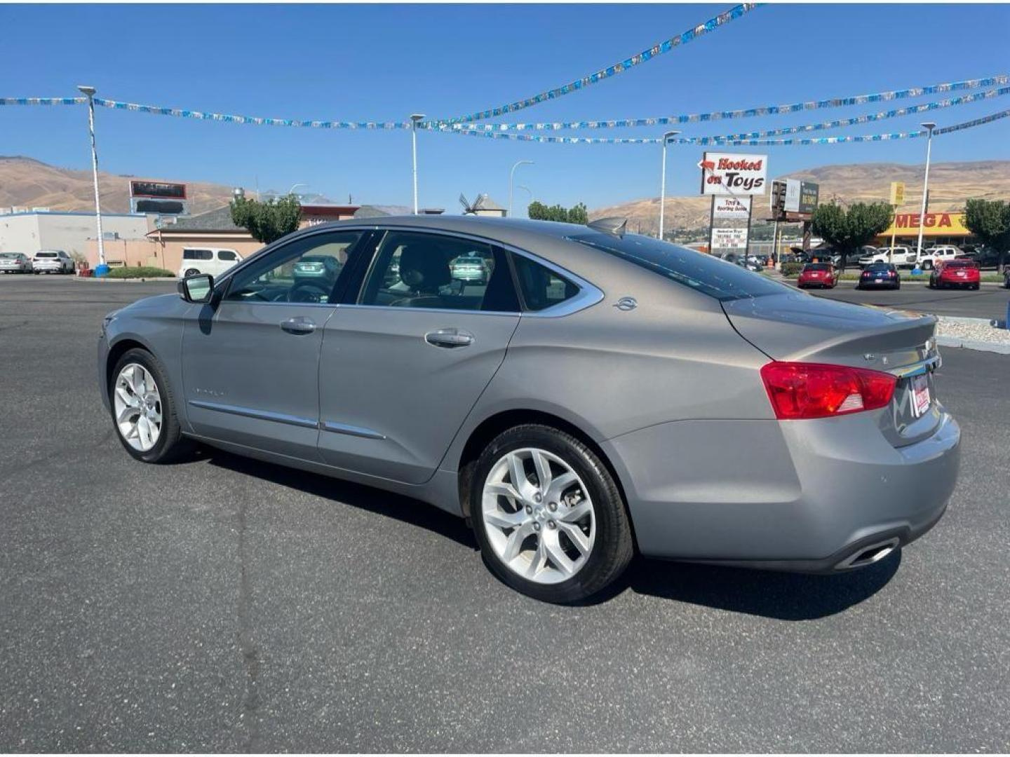 2018 Pepperdust Metallic /Jet Black Chevrolet Impala Premier (2G1125S36J9) with an 3.6L V6 DOHC 24V engine, 6A transmission, located at 6064 Gull Rd, Kalamazoo, MI, 49048, (269) 222-0088, 42.328388, -85.512924 - <b>Equipment</b><br>You'll never again be lost in a crowded city or a country region with the navigation system on this Chevrolet Impala. Engulf yourself with the crystal clear sound of a BOSE sound system in the vehicle. The leather seats in this vehicle are a must for buyers looking for comfort, - Photo#7