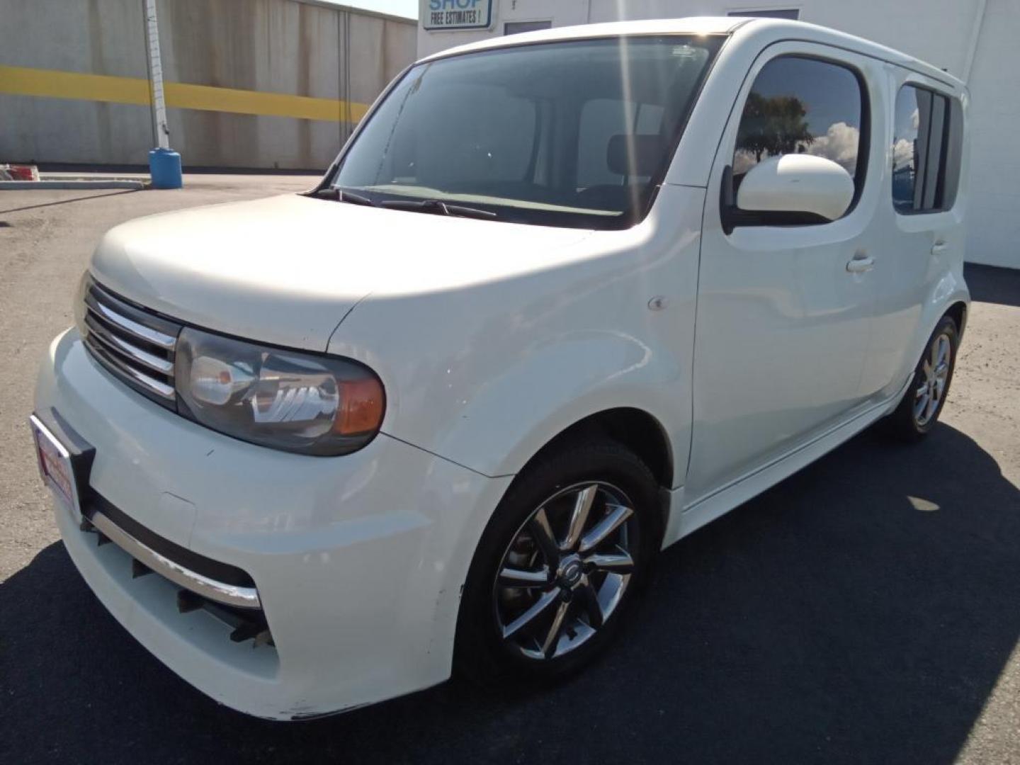 2011 White Pearl /Black/Gray Nissan cube 1.8 (JN8AZ2KR2BT) with an 1.8L L4 DOHC 16V engine, 6-Speed Manual transmission, located at 6064 Gull Rd, Kalamazoo, MI, 49048, (269) 222-0088, 42.328388, -85.512924 - <b>Equipment</b><br>You'll never again be lost in a crowded city or a country region with the navigation system on this small suv. Bluetooth technology is built into the Nissan cube, keeping your hands on the steering wheel and your focus on the road. This small suv is equipped with the latest gene - Photo#2